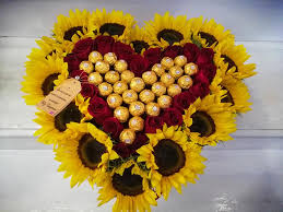 - Sweet Love - Sweet Love - - 14 sunflowers stems , 20 red roses and 27 pieces of delicious Ferrero Rocher chocolates