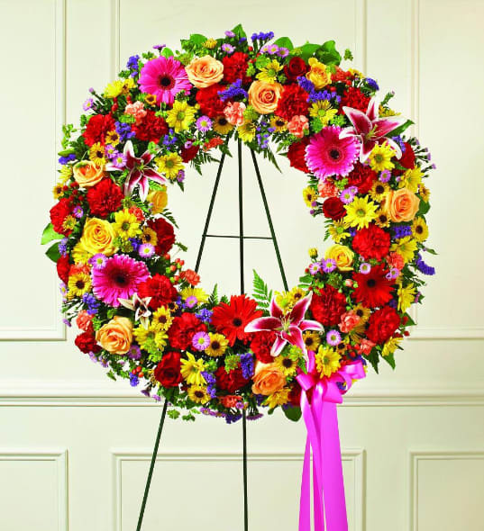 Bright Wreath - A sympathy wreath arranged with bright, vibrant colors is a special way to remember a dearly departed. Our Colorful Sympathy Wreath will display beautifully and lend comfort and support during a difficult time.