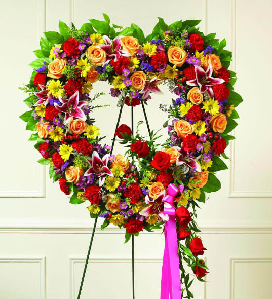 Bright Open Heart - Our Colorful Sympathy Heart Wreath is a standing arrangement that is created to lend comfort during a difficult time. This bright and beautiful tribute to a dearly departed will extend your most sincere condolences.