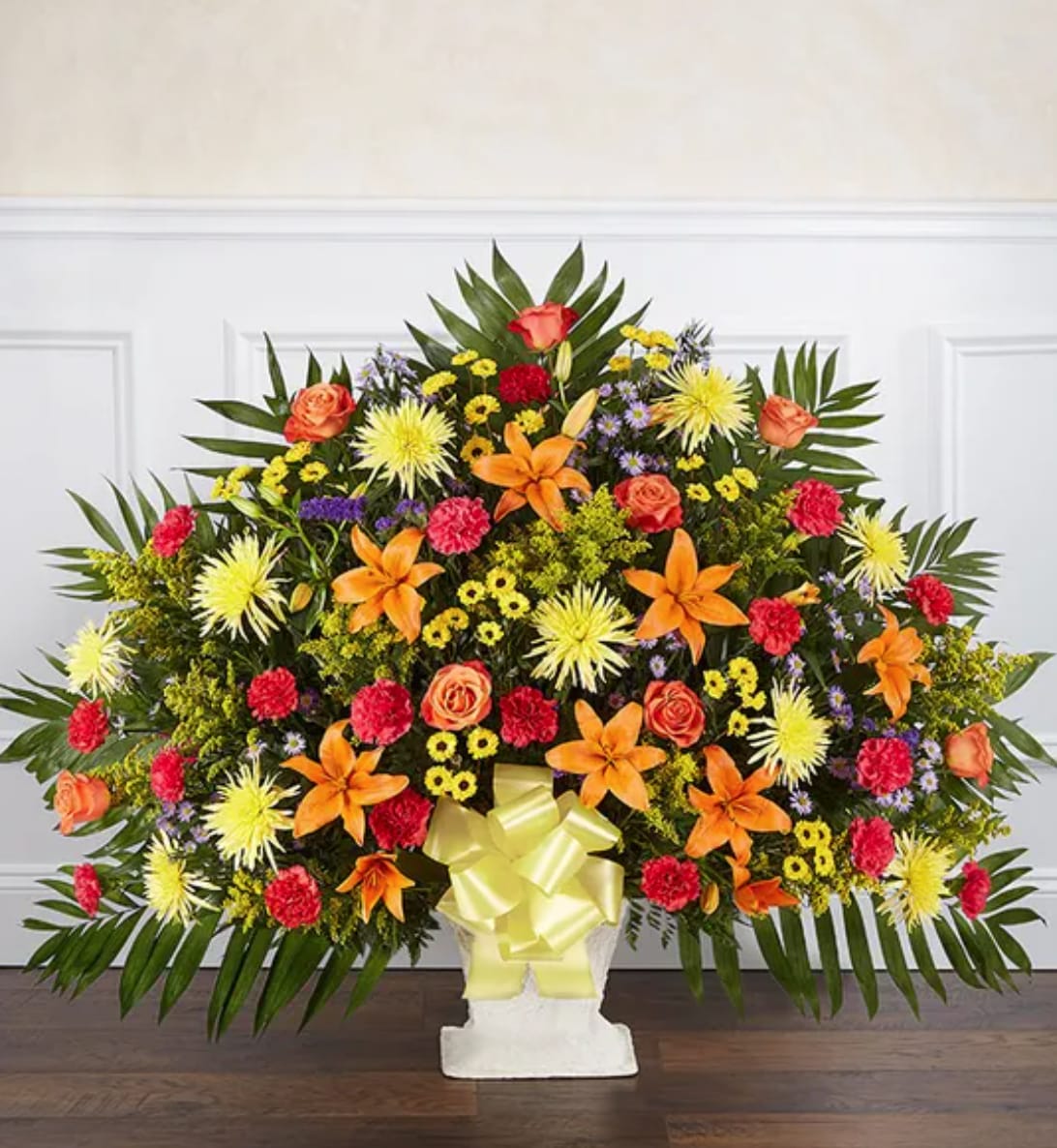 Heartfelt Tribute™ Floor Basket- Bright - They had a passion and exuberance that was undeniable. These qualities are captured in stories, memories and the vibrancy of our basket arrangement. This lush display of blooms in bright colors is beautifully crafted, creating an impressive tribute to celebrate their life.
