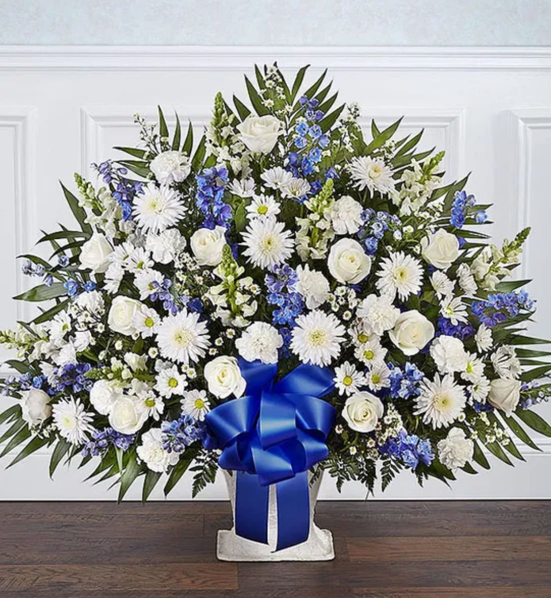  Heartfelt Tribute™ Blue &amp; White Floor Basket Arrangement - Offer the peace and tranquility that comes from classic blue and white flowers. Our elegant floor basket arrangement, handcrafted by our caring florists with pristine white and blue blooms, is a tasteful gesture perfectly suited for the funeral home or memorial services.
