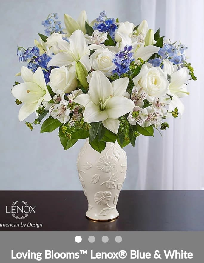 Loving blooms blue and white Loving blooms blue and white - Description EXCLUSIVE Offer heartfelt comfort and support with our Loving Blooms™ bouquet. Heavenly blue and white flowers are artistically arranged inside our exclusive ceramic vase. The touching keepsake features an exquisite raised floral design and a 24 karat gold trim at the base for a beautiful expression of your sympathy.Container can be different ceramic container, same look and same values.