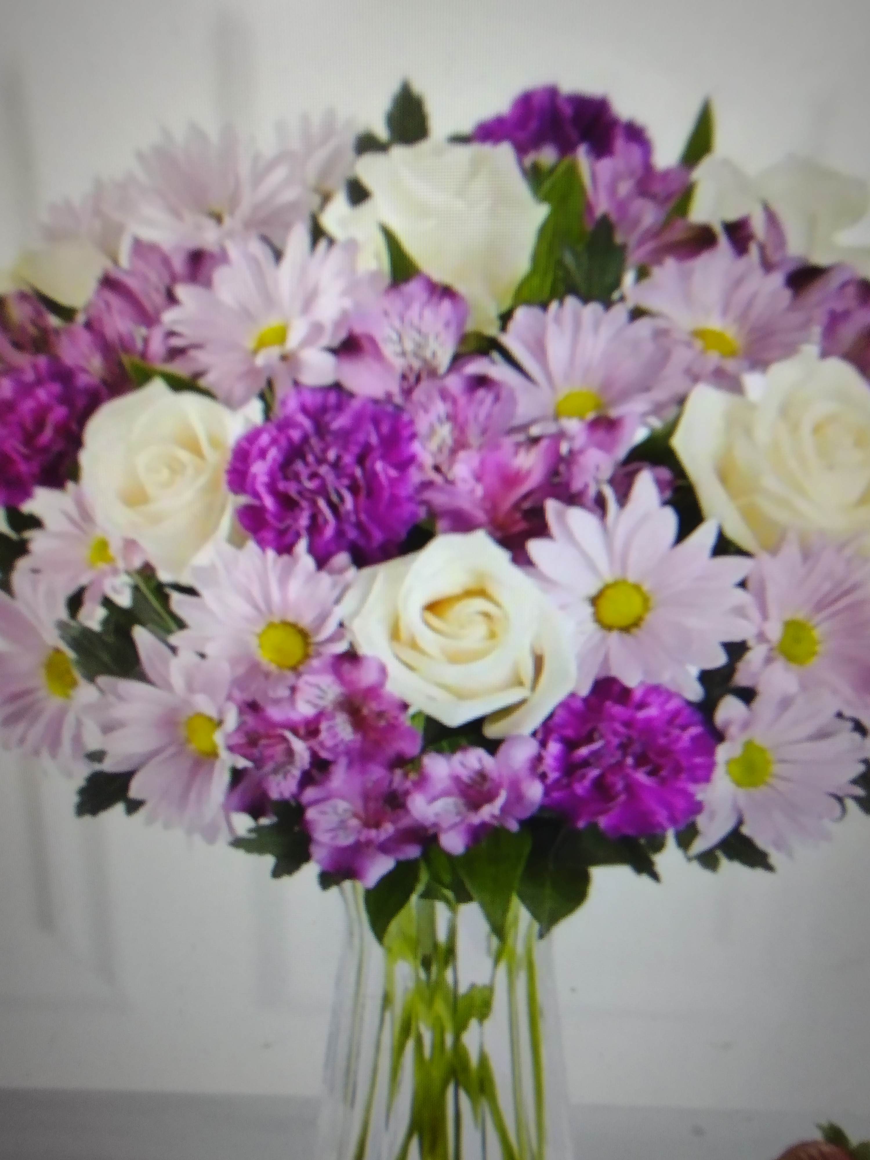 Mother's Day Purple Lover - Beautiful arrrangement full of purple flowers for those who love purple. With an added touch of white roses and fresh lush greenery to round it all out.
