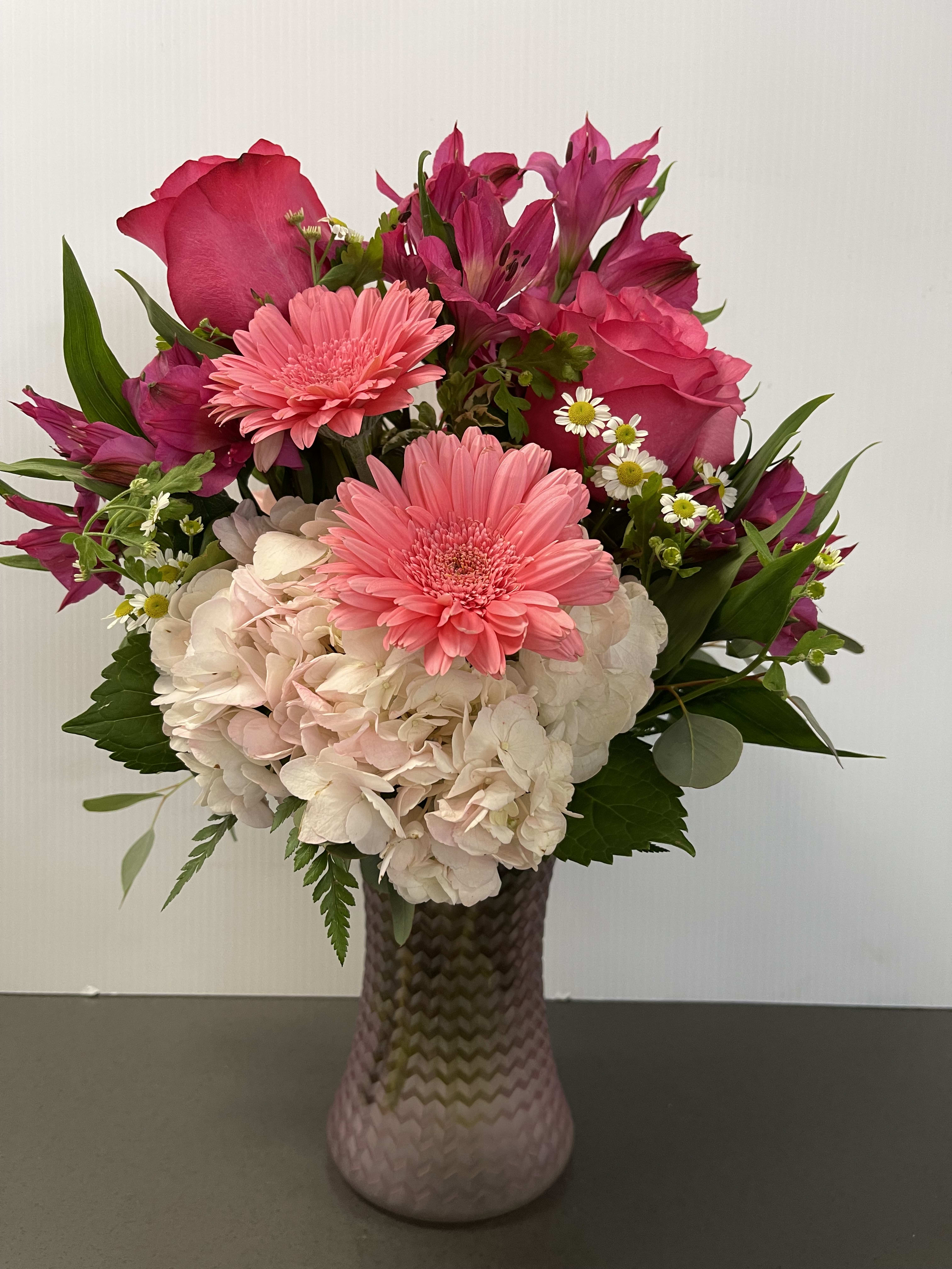 Pink Fusion - Frosted pink or lavender vase, with hydrangeas, alstromeria, gerbs, roses, touches of fever few. Colors may Vary