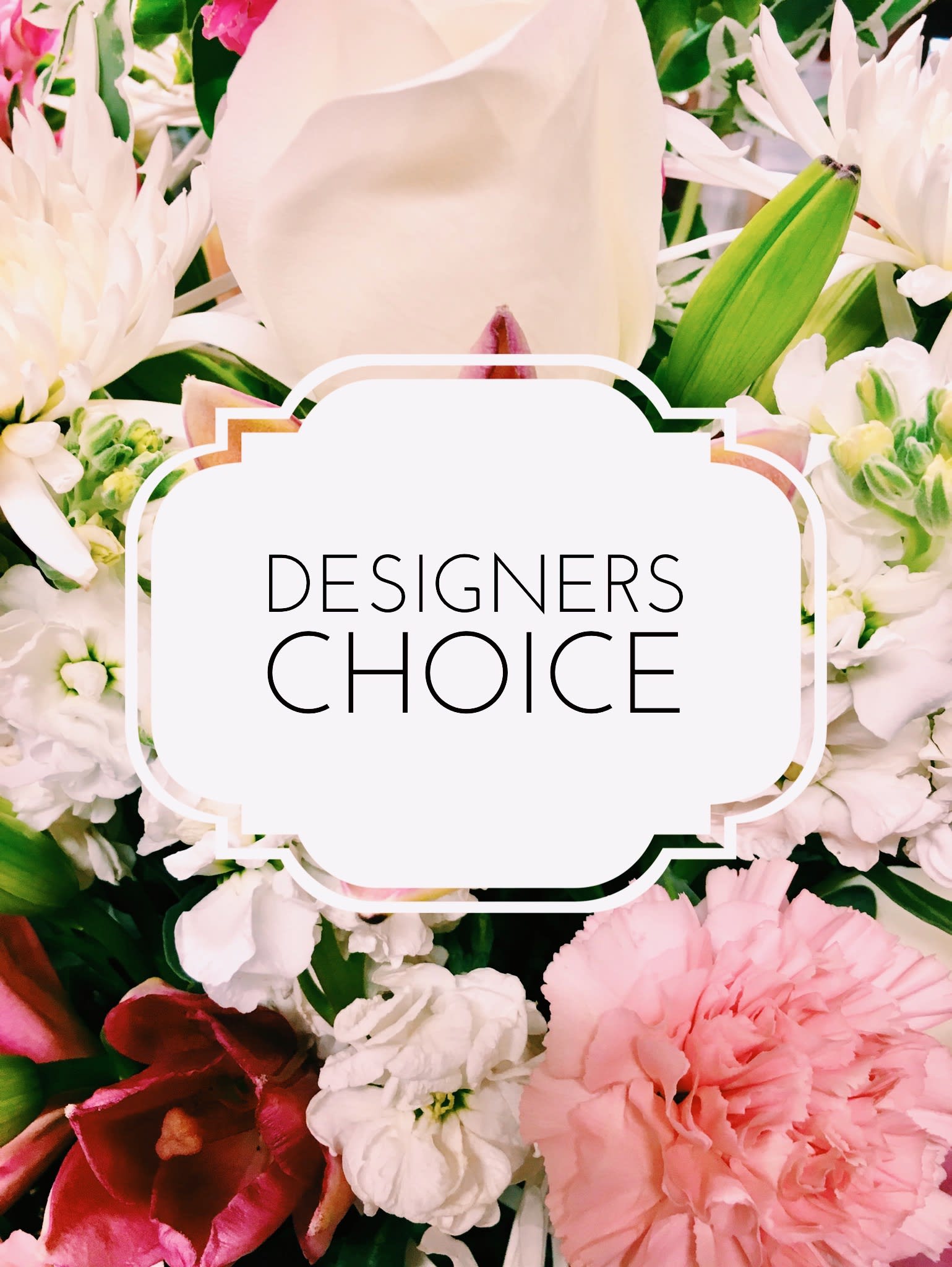 Designers Choice  - A florist designed fresh floral bouquet in a vase with assorted colors and flowers.