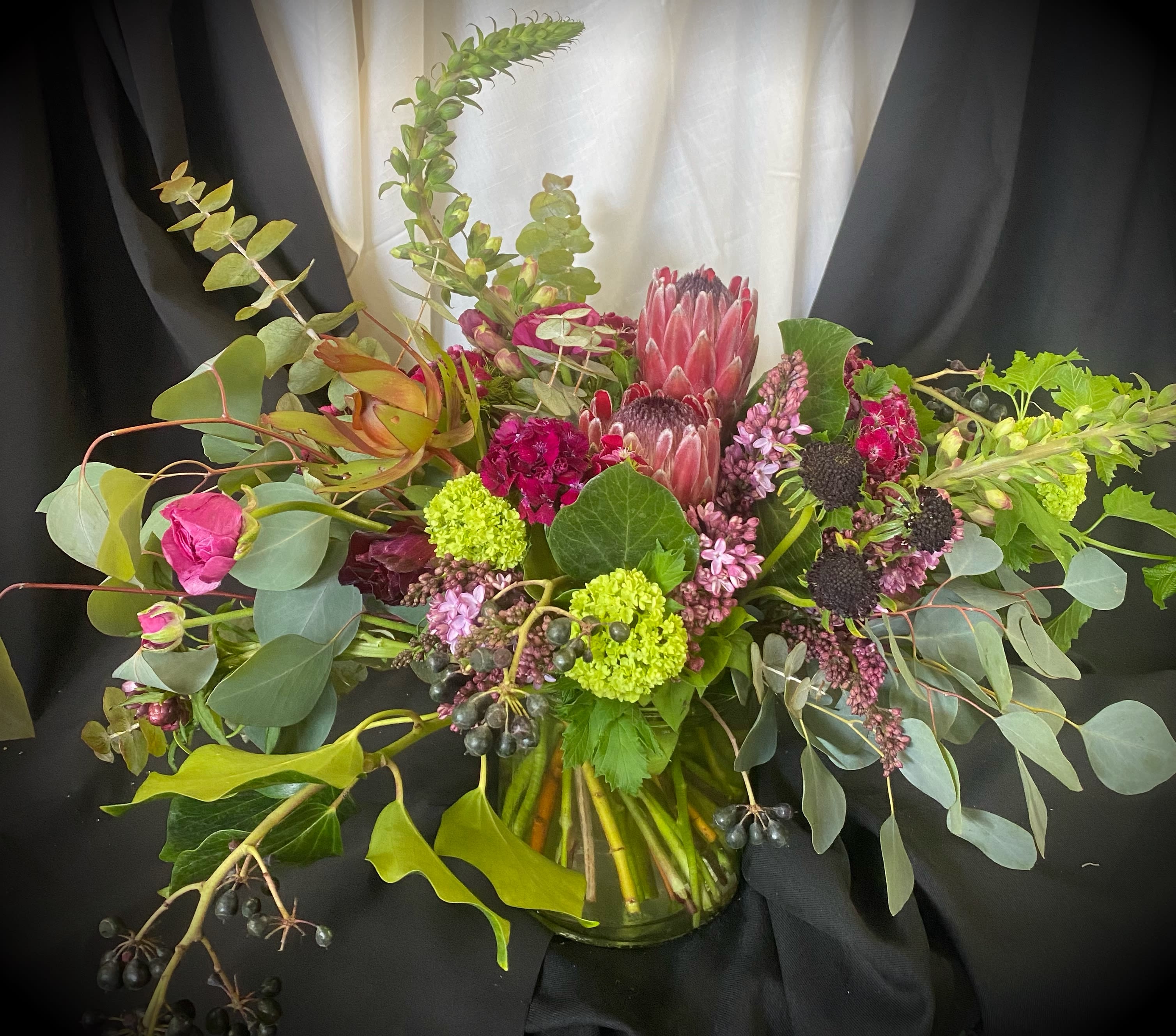 Isabella Rose Isabella Rose - This bouquet is artistry at its best. The vast color palette is a winner for that enthusiast of nature and all the colors it rewards.