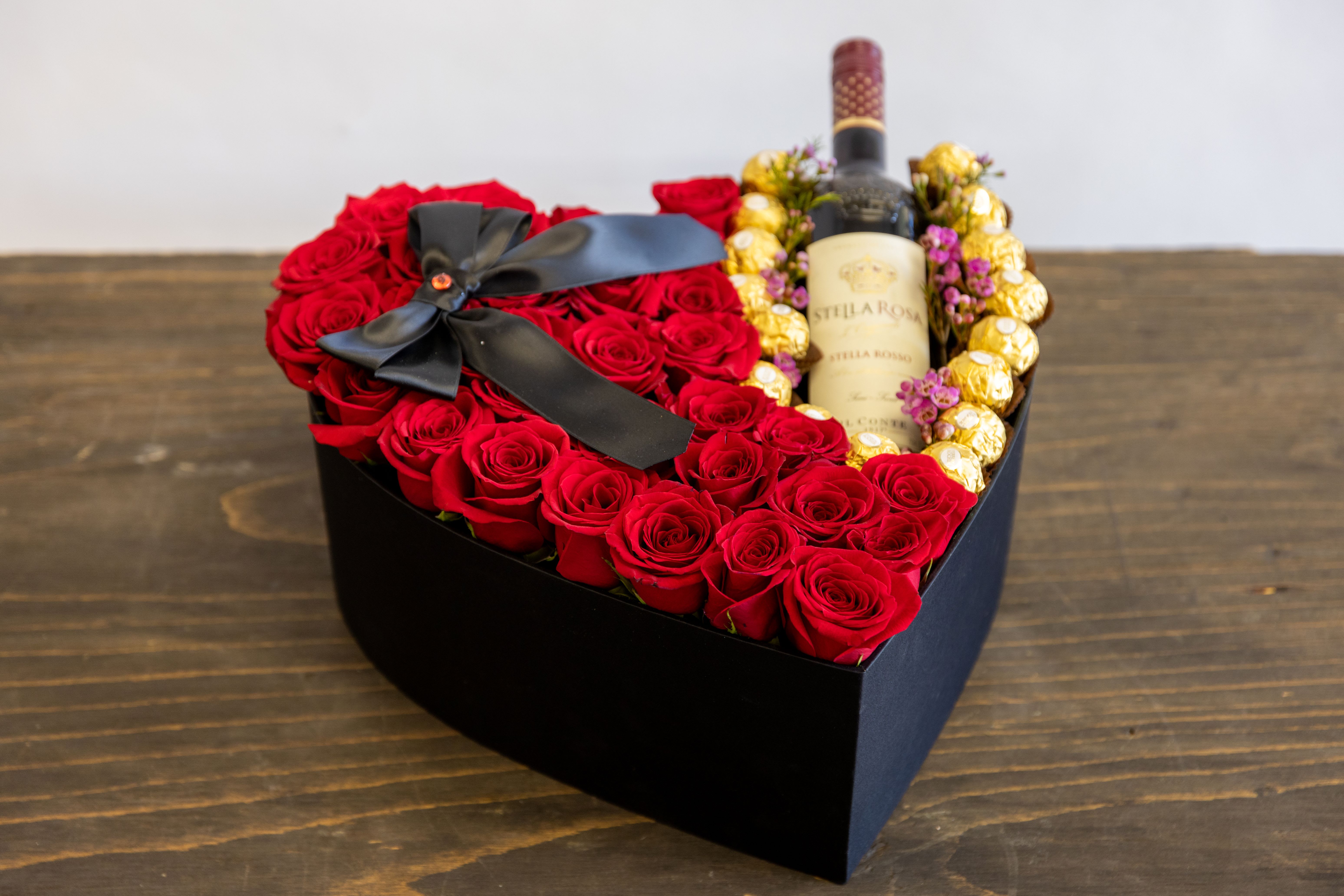 Apology Apology - Heart Shaped box filled with roses chocolates and a bottle of wine!