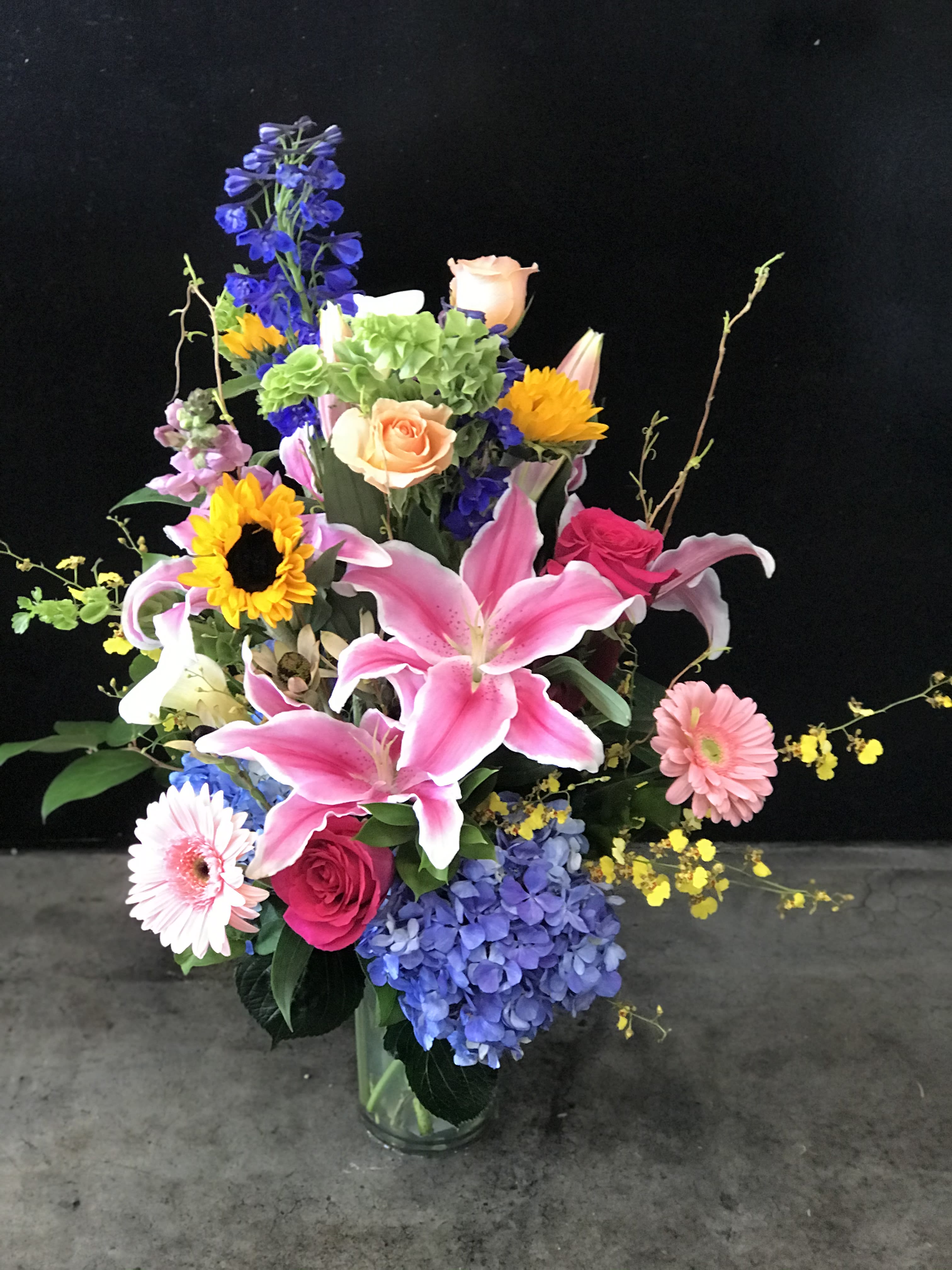 Roxie - Bright &amp; colorful Mixed Bouquet in a vase with greens