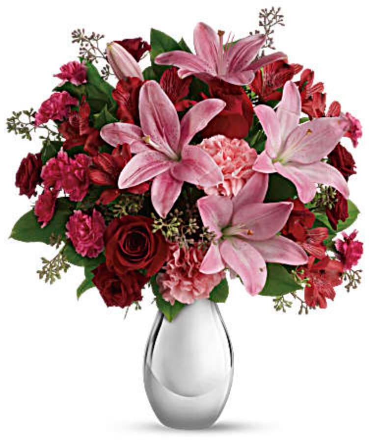 Moonlight Kiss Bouquet - Love blooms spectacularly in this dazzling array of roses, lilies, alstroemeria and more artistically arranged in a sparkling silver reflections vase. 
