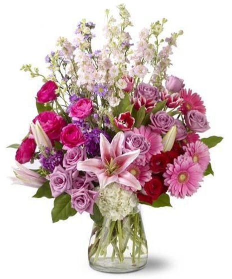 A PerfectDay - This bouquet is unforgettable with it's vivid display of vibrant blooms.  Eye catching stargazers unfold their petals against the orange roses, alstromeria, blue hydrangea and more. Sure to express your happiest wishes.