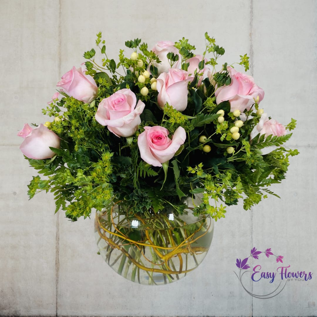 Peach Rose Pride - Experience the Beauty of Nature with Our Peach-Colored Rose Bouquet - Looking for a stunning display of nature's most extraordinary masterpieces? Our elegant bouquet features an exquisite peach-colored rose, delicately arranged in a glass bubble bowl with various greens and coordinating filler flowers. Whether you're celebrating a special occasion or simply want to add a touch of beauty to your home or office, this stunning design is sure to impress. Order now and experience the magic of nature's most beautiful creations.