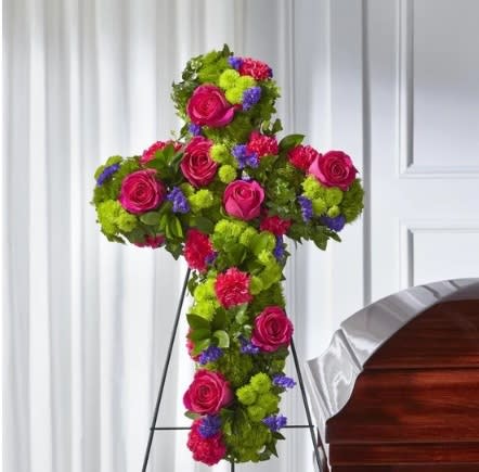 Vibrant Tribute Cross Vibrant Tribute Cross - This vibrant and beautiful cross has roses, statice, dianthus and button pompoms and is a glorious way to remember your loved one.