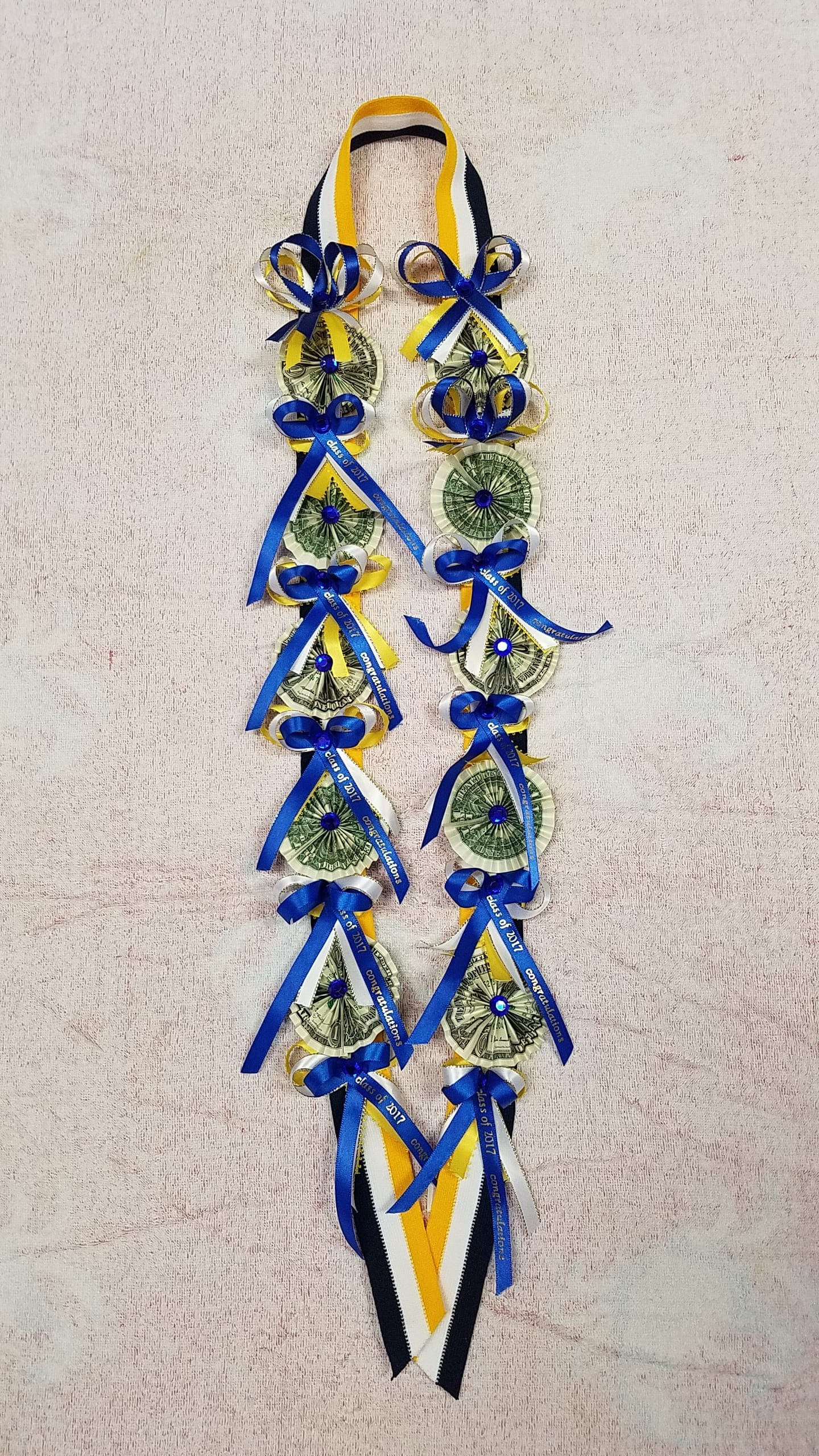 Money lei #4 Money lei #4 - (10) $1 bills attached to fabric lei NO RETURN OR REFUND. ALL SALES ARE FINAL