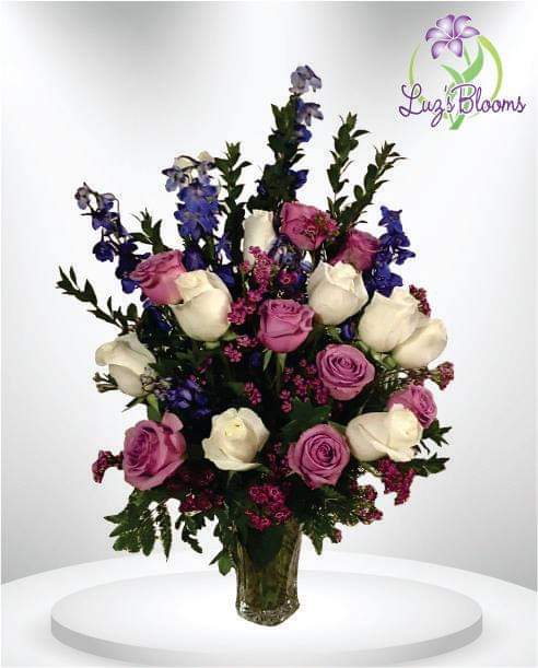 Take My Breath Away - Classic bouquet featuring and array of blues, lavander, and beautiful green colors.  Perfect for any occasion.