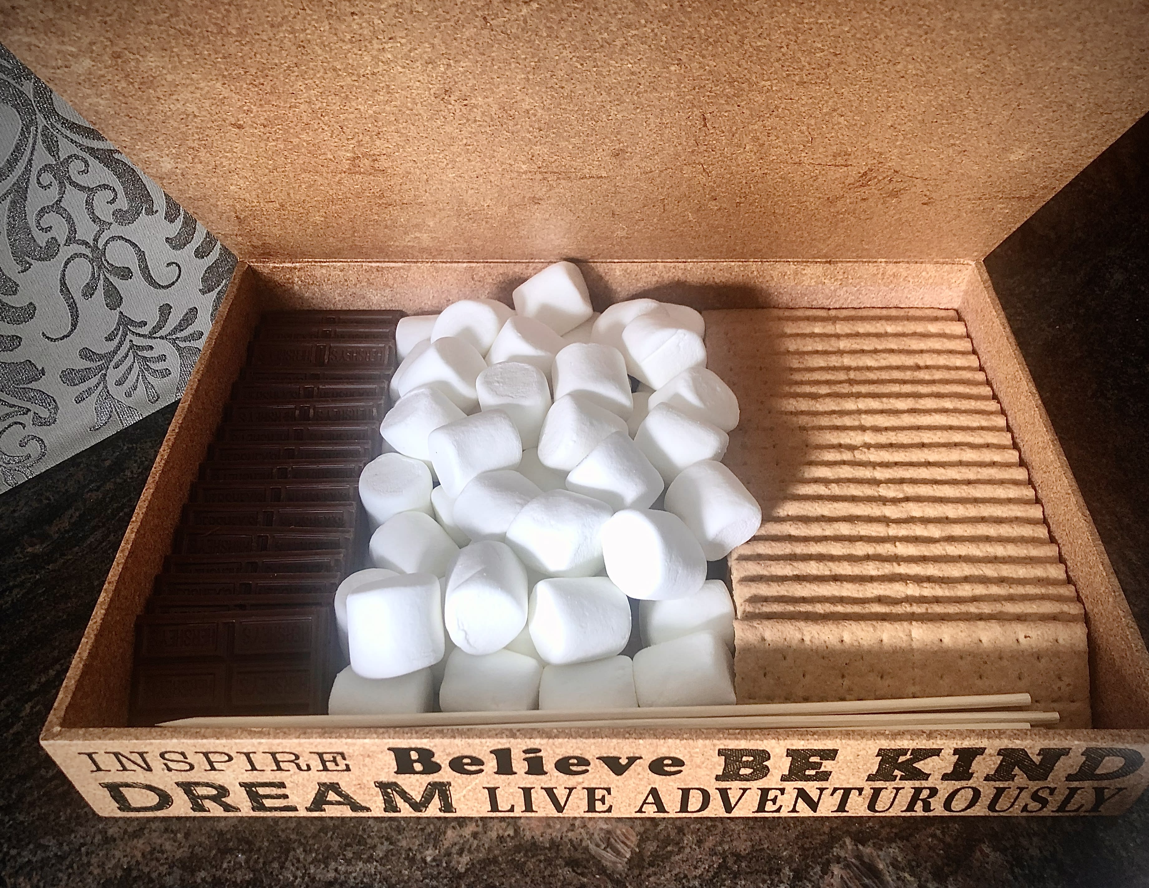 S'mores box - Everything you need for s'mores.  Marshmallows, chocolates, gram crackers and wooden skewers