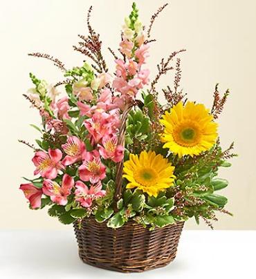 Summer Garden Basket Summer Garden Basket - Summer style bursts on the scene with this garden-fresh, hand-designed bouquet of snapdragons, roses, sunflowers, alstroemeria and more. Designed by our florists in a reusable handled basket, it's just right for a Summer centerpiece, home décor sprucer-upper, or to simply send a smile to someone you care about.