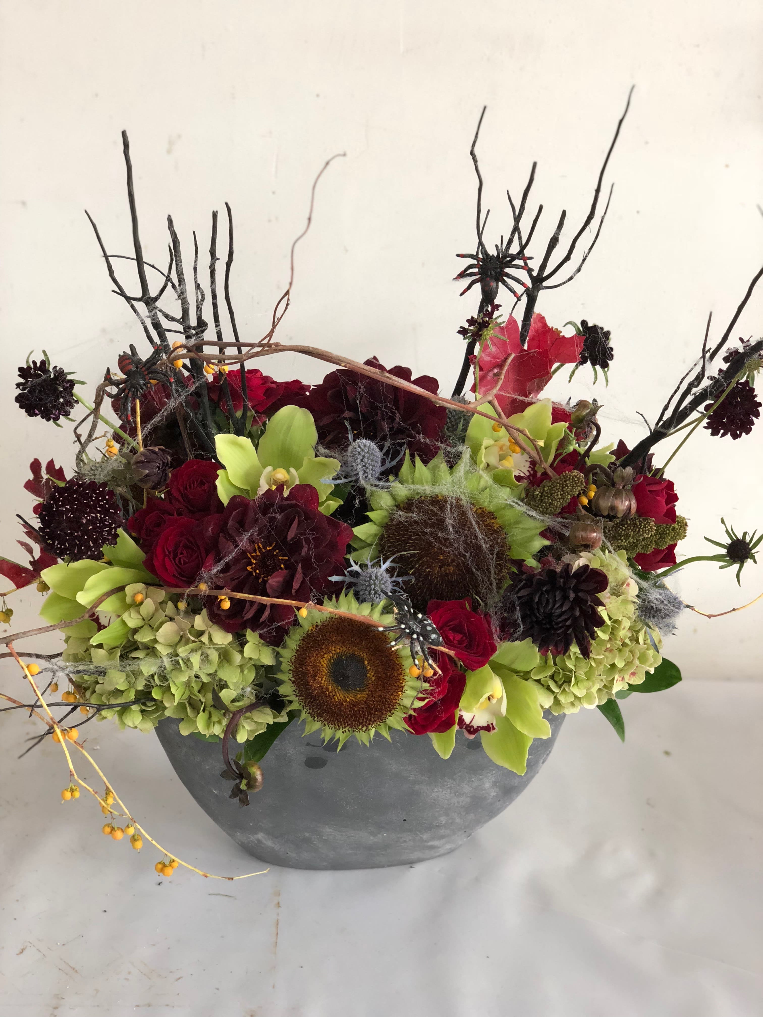 Halloween spooktacular Halloween spooktacular - A spooky arrangement of roses, dahlias, orchids and sunflowers