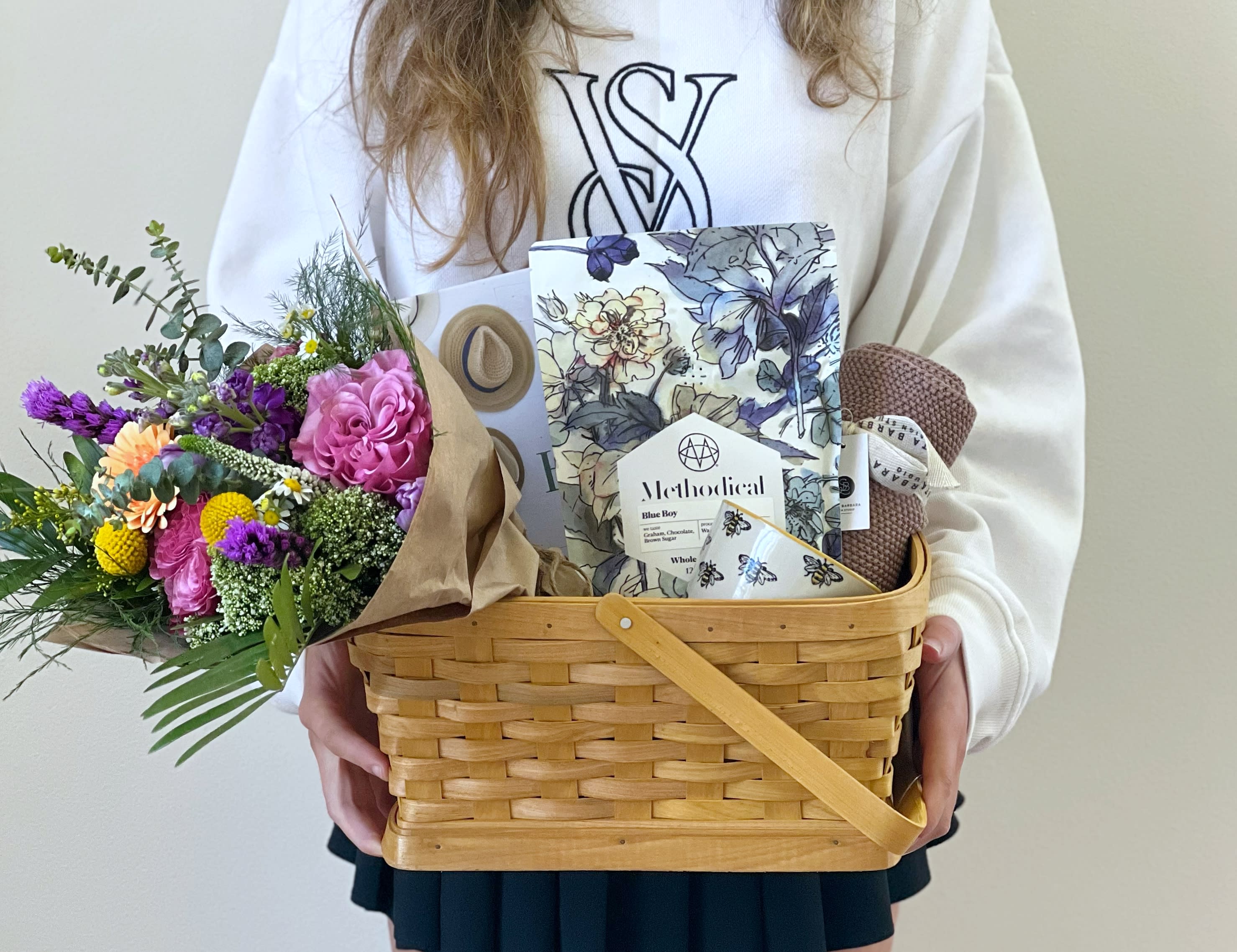 Homebody Gift Basket - Meet the Homebody gift basket. Filled with Methodical Coffee beans, a beautiful coffee mug, tea towel, the gift of home book by Bre Doucette, and of course a beautiful wrapped flower bouquet! 