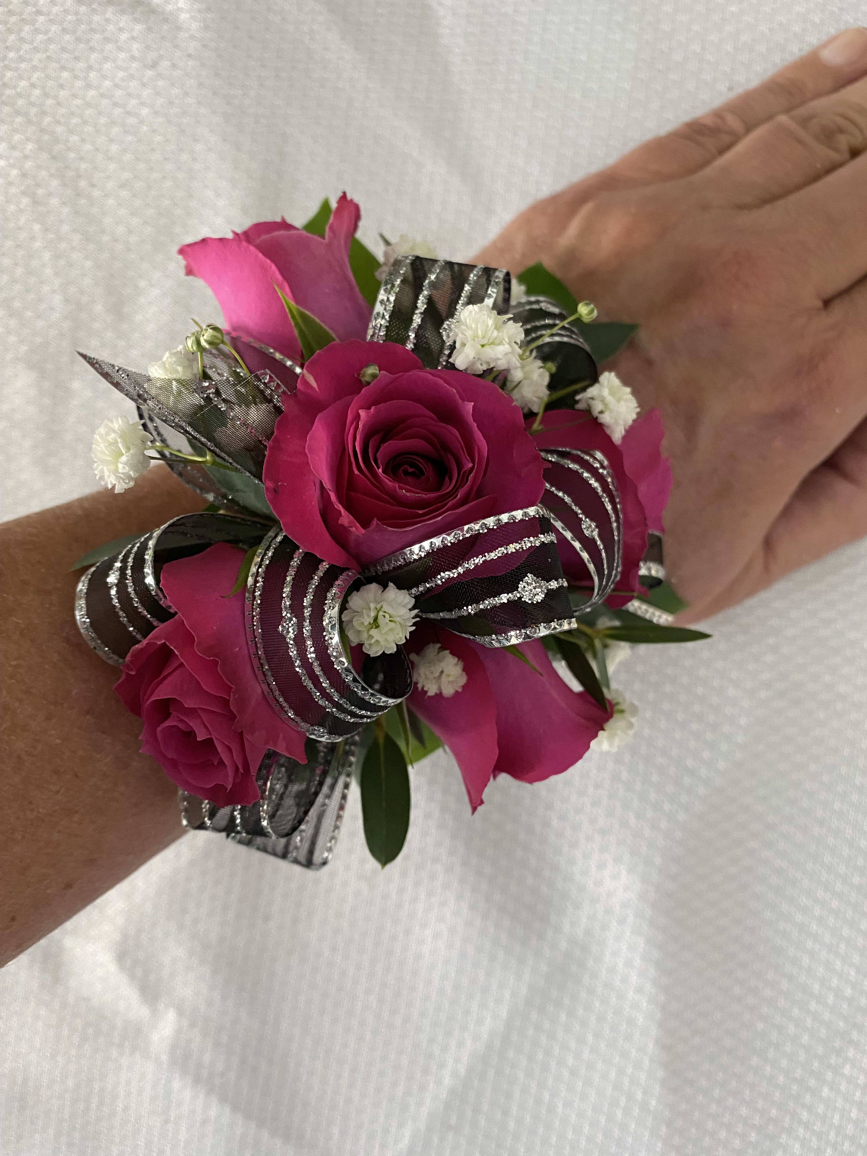 Hot pink wrist corsage in East Rochester, NY | The Flower Shop