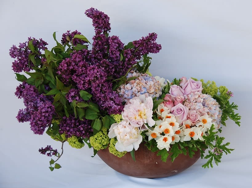 Lilac &amp; Narcissus  - A concrete pot filled with lush lilacs, peonies, roses, viburnums, and narcissus.