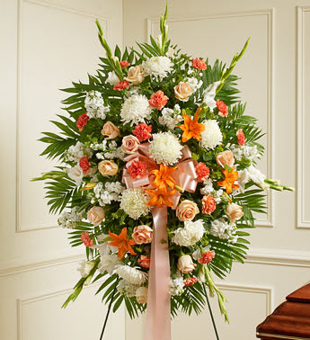 Deepest Sympathy Standing Spray-Peach/Orange/White - This Sympathy Standing Spray includes Peach roses, orange Asiatic lilies, white carnations and more. An appropriate gift for family, friends and business associates to send directly to the funeral home Our florists use only the freshest flowers available so colors and varieties may vary Large measures approximately 52&quot;H x 42&quot;L without easel Medium measures approximately 46&quot;H x 38&quot;L without easel Small measures approximately 42&quot;H x 30&quot;L without easel.  MUST BE ORDERED 1-2 IN ADVANCE
