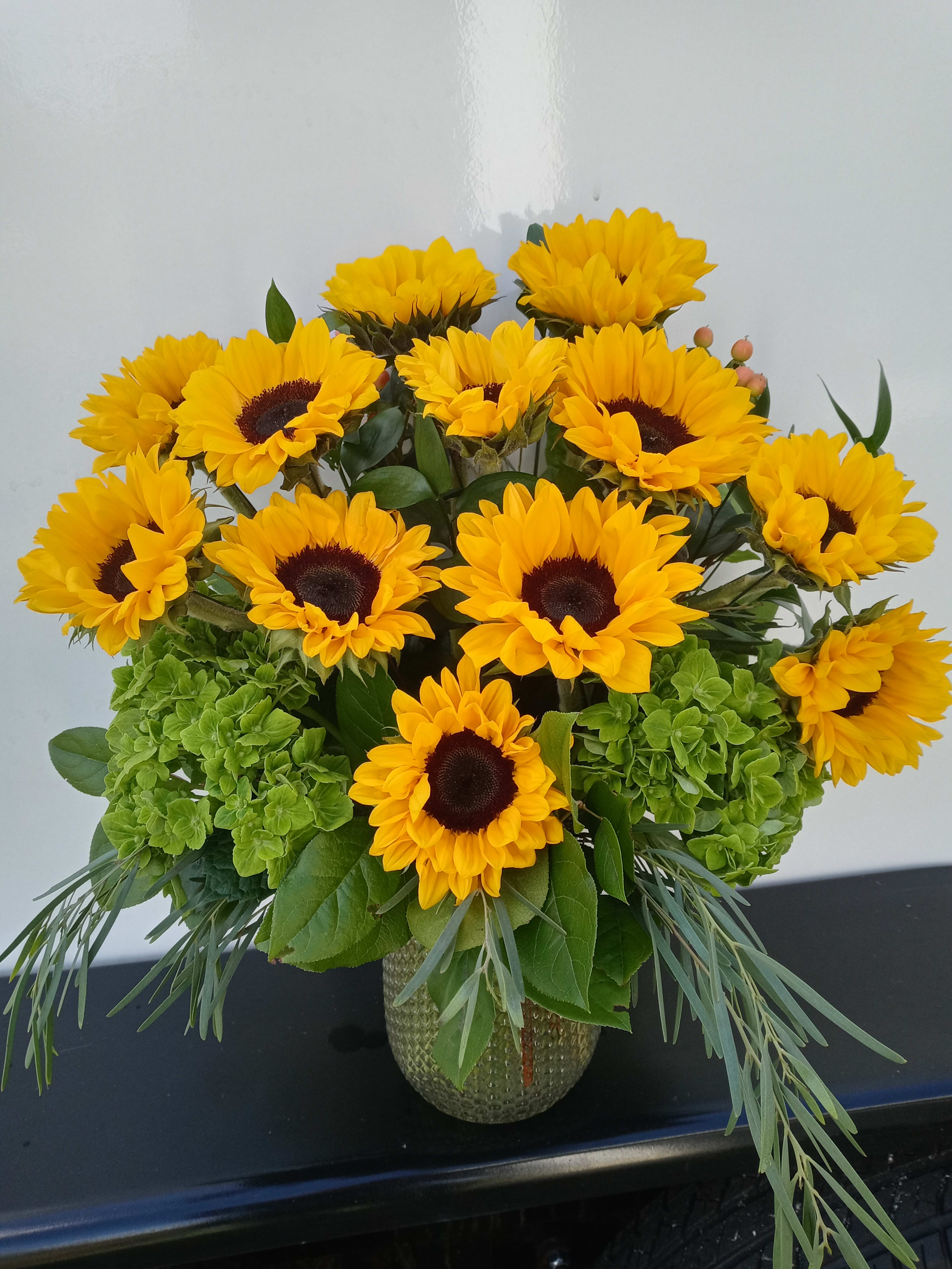 Sunflower Dozen - One dozen sunflowers arranged in a vase,