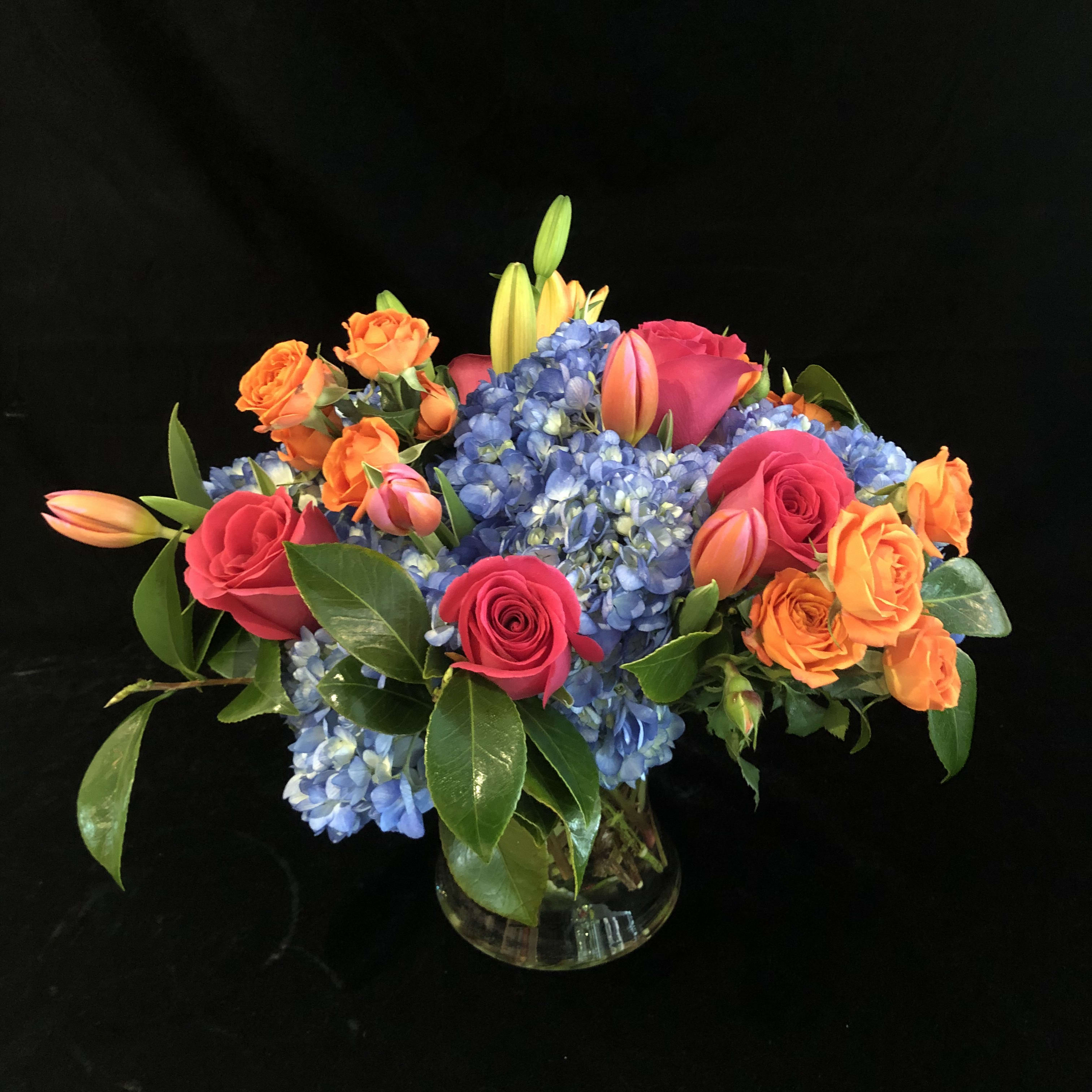 Bright Designers Choice - Bright, fun, cheerful flowers. Exact combinations may vary due to availability but we assure you a bright, fun combination of flowers.