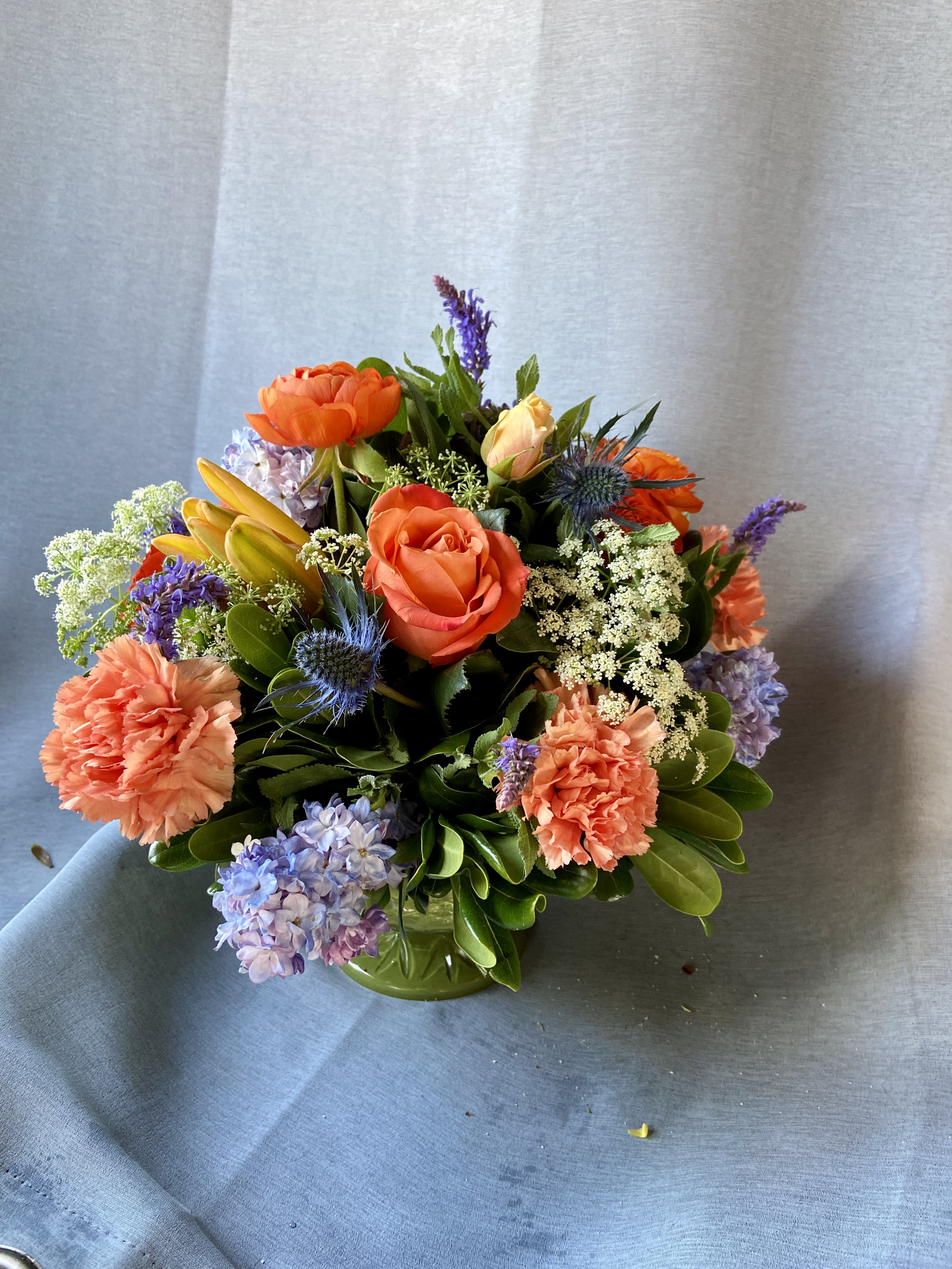 Denim And Peaches  - This lovely mixed of long lasting flowers arranged in a green compote, perfect gift for any occasion .