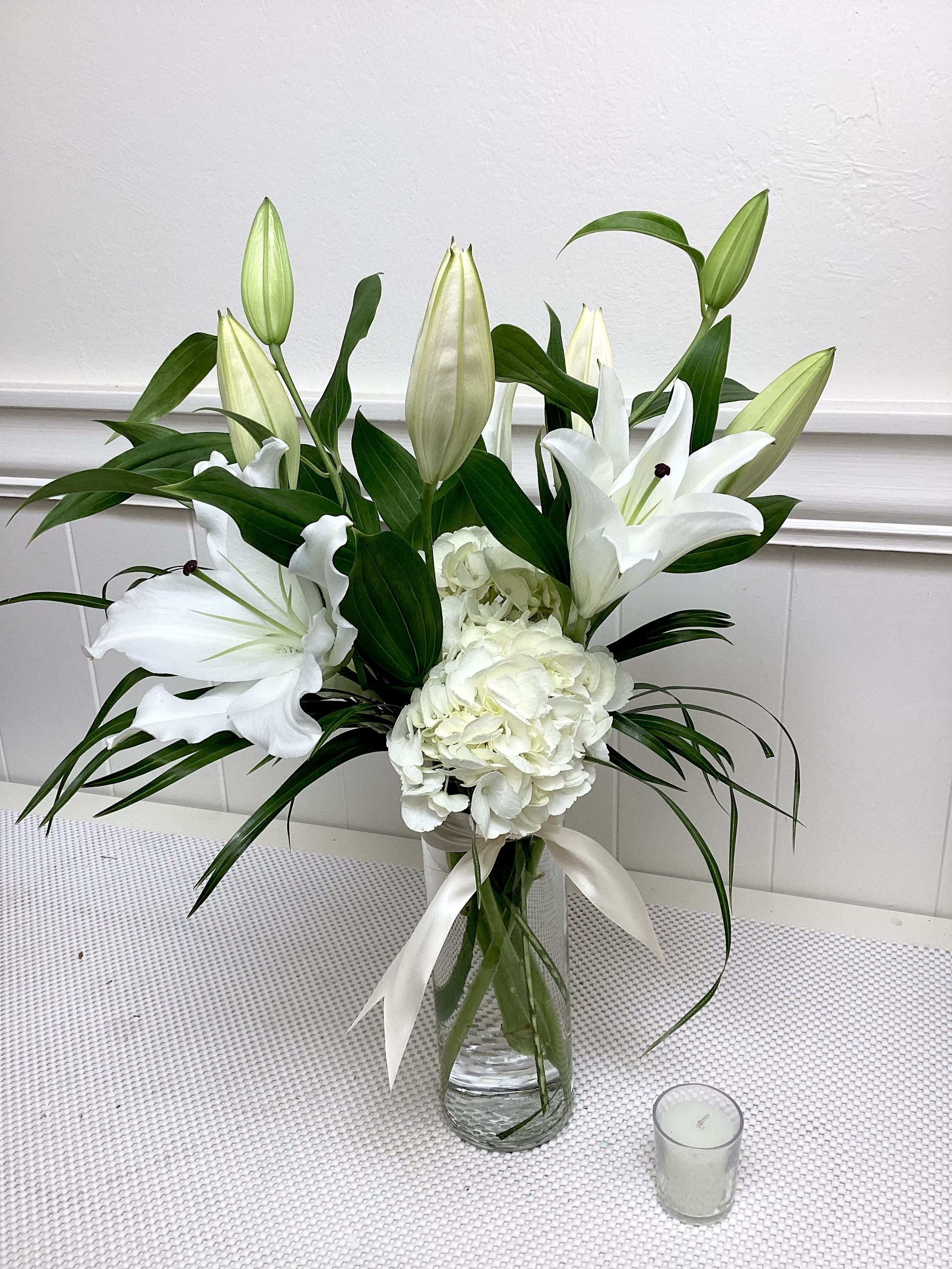 Sweet Fragrance - This statuesque and aromatic arrangement includes fragrant lilies, hydrangea, and Phoenix Palm. 