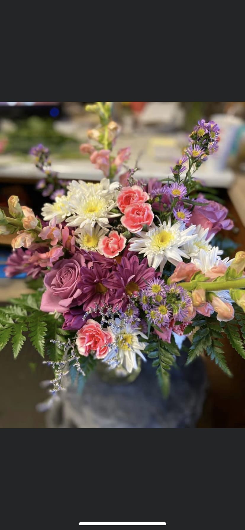 Lily of the Ball Lily of the Ball - Beautiful mix of bright mini carnations, snap dragons, carnations, and roses complete this look for your favorite someone.