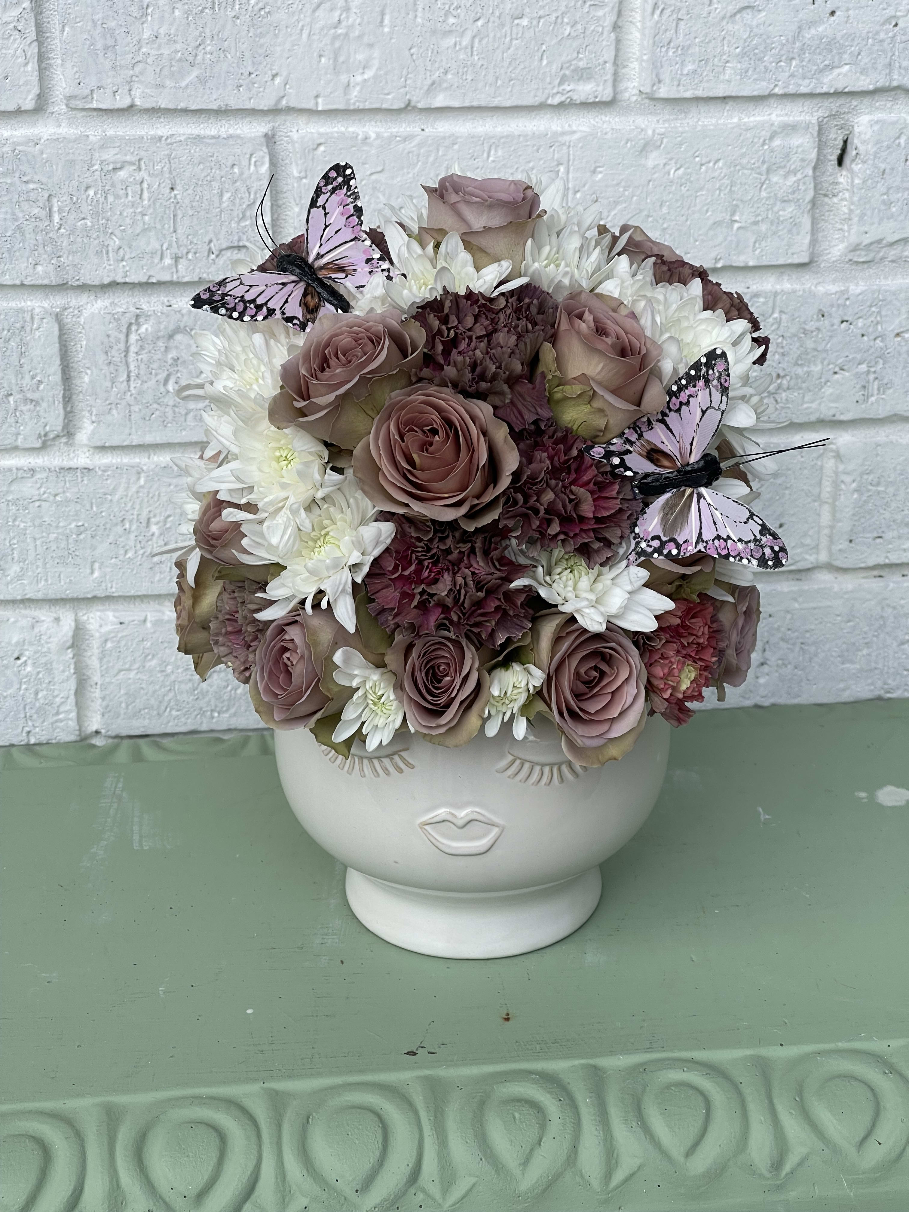 The antique lady The antique lady - a beautiful ceramic head filled with a variety of roses, vintage carnations and a variety of beautiful flowers