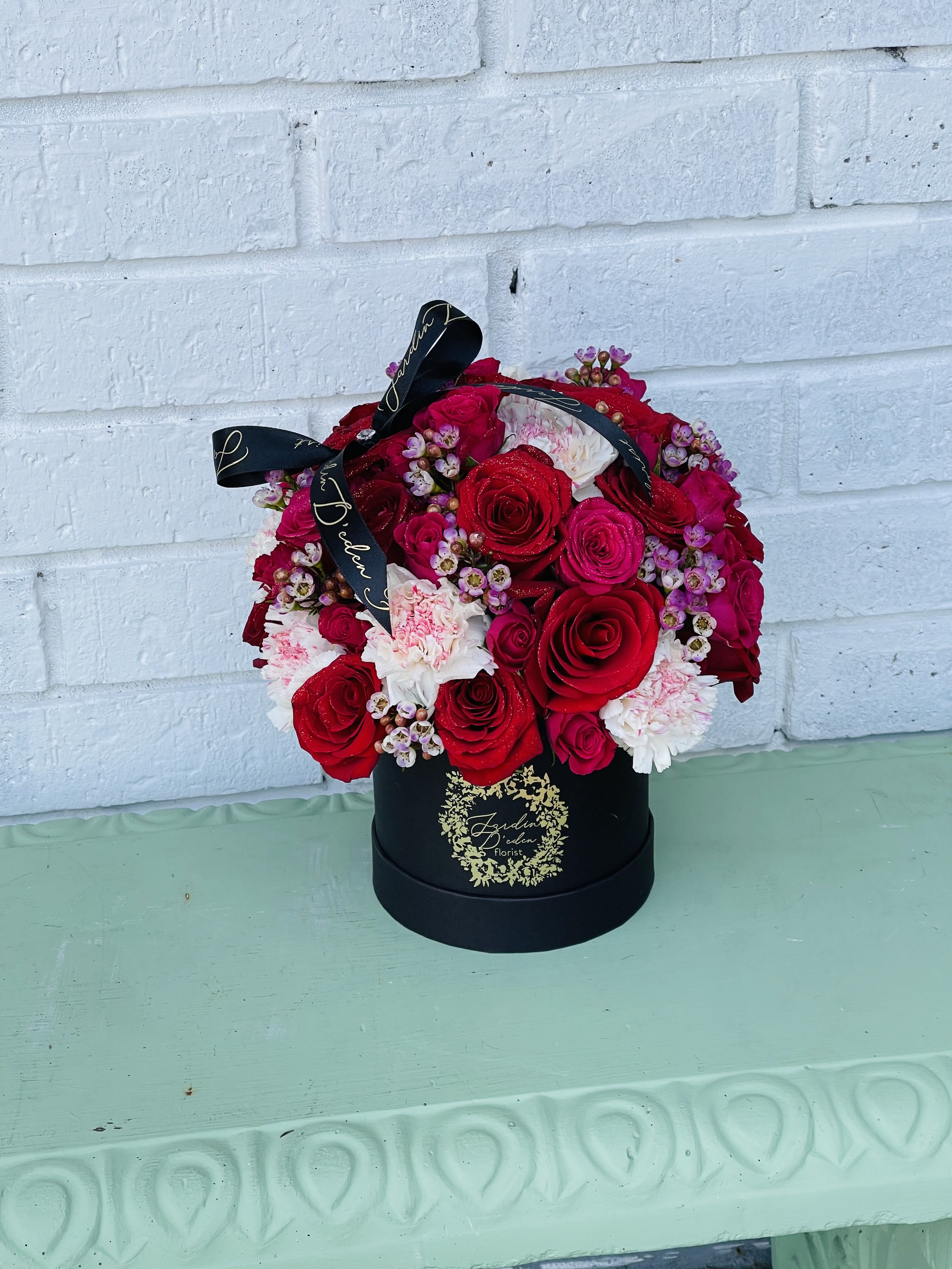 the creative garden bloom box  - If you want something trendy this beautiful bloom box would be ideal for any type of occasion. This box is filled with roses, carnations, spray roses, wax flower and a variety of filler flowers 