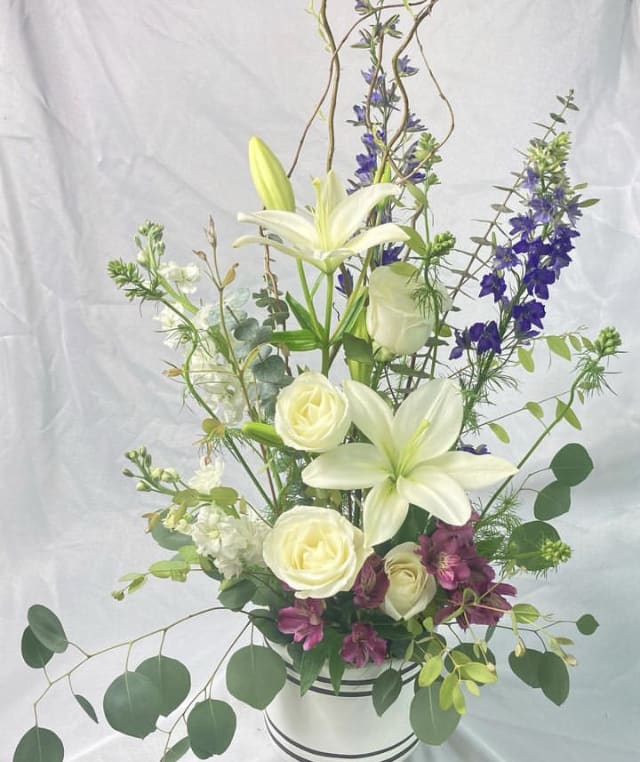 Style &amp; Beauty - Wow them with a  stylistic, modern, flower arrangement of Casablanca Lilies, Curly Willow, Roses, Larkspur, Alstroemeria in a keepsake planter.  