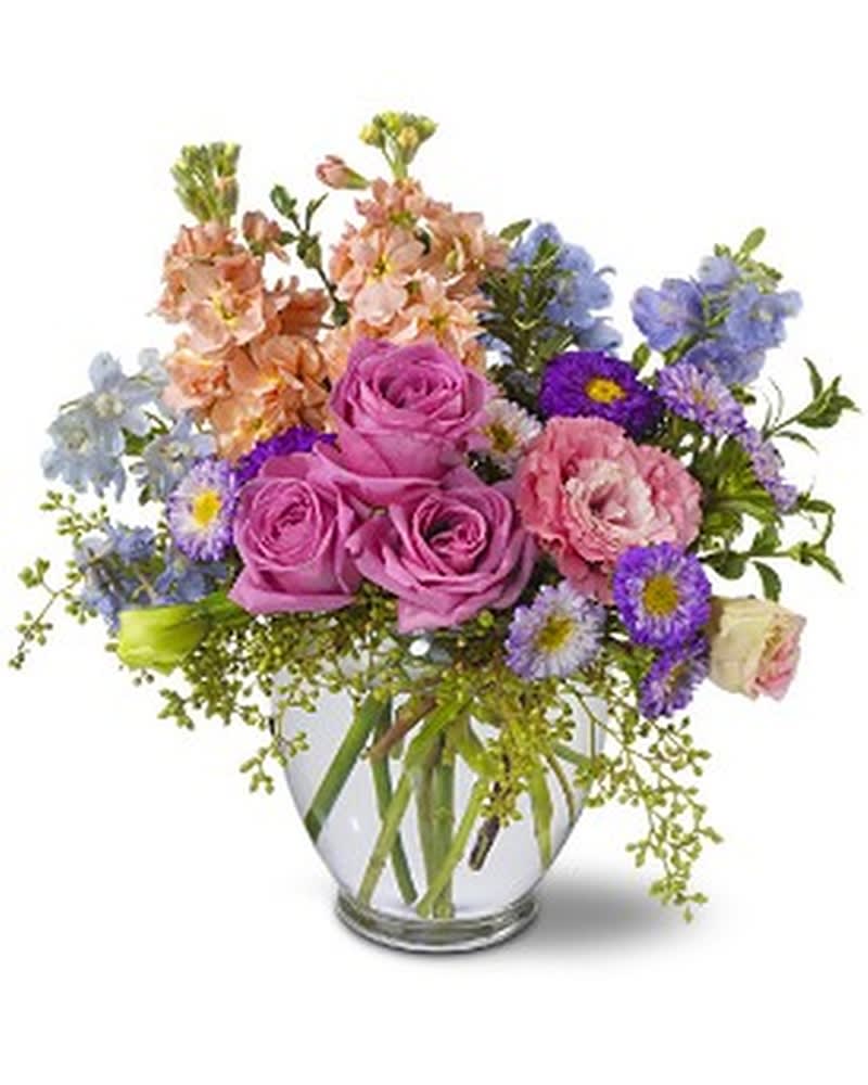 Heaven Scent - A divine mix of lavender roses, plus pink and blue blossoms - with a touch of seeded eucalyptus - will seem as if it were &quot;scent&quot; straight from heaven! This lovely bouquet will be received with open arms. Pink stock and lisianthus, light blue delphinium, lavender roses and Matsumoto asters â accented with seeded eucalyptus and oregonia â are delivered in a clear glass vase. Approximately 11&quot; (W) x 14&quot; (H) Orientation: All-Around As Shown : TFWEB151