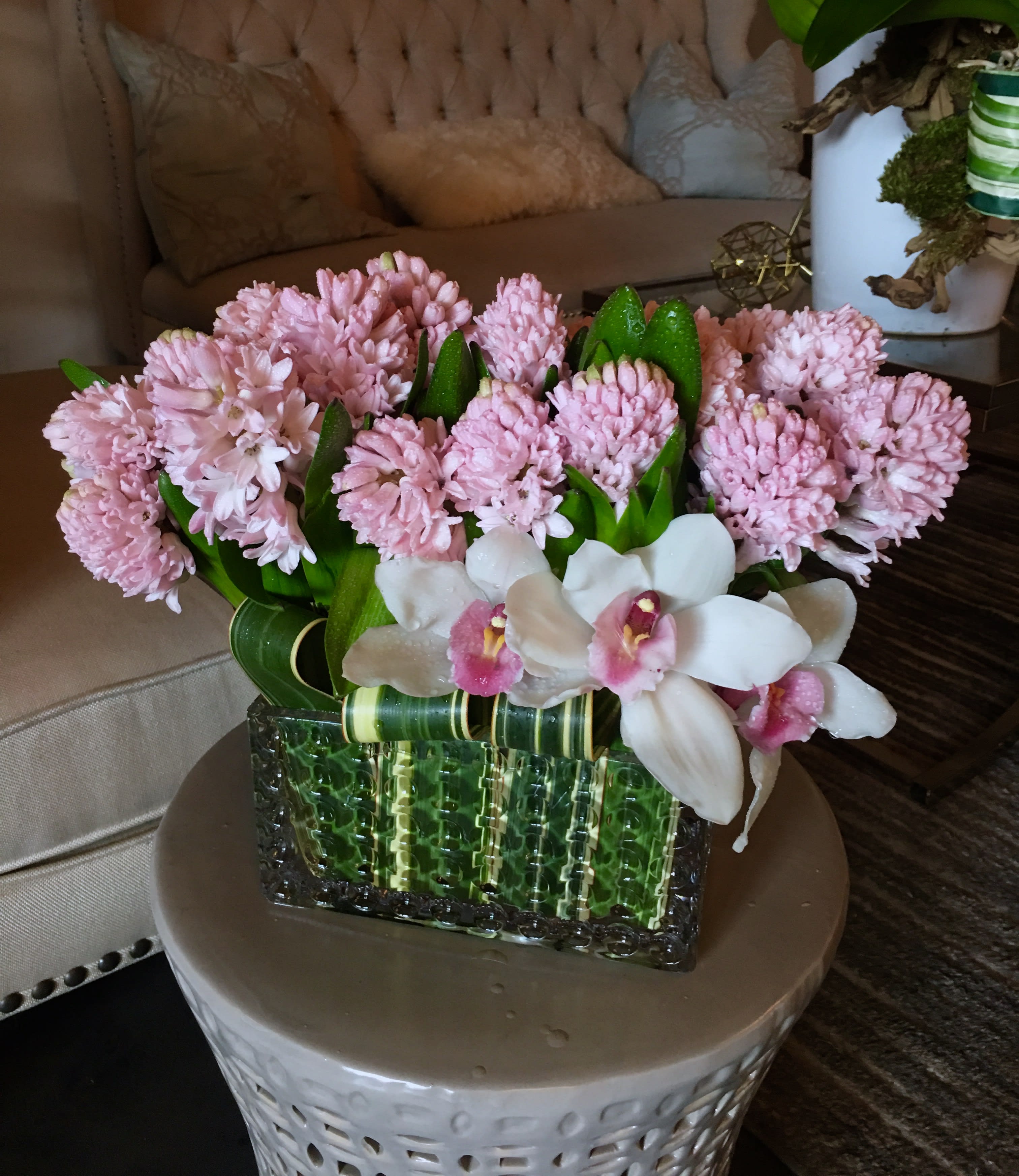 Hyacinth Me - This sweet arrangement is overflowing with fragrant pink hyacinth, and the touch of white and pink cymbidium orchids gives it that perfectly lil LA Premier flair. An adorable arrangement that sits pretty in pink in a decorative rectangle vase.  *vase subject to availability vase dimensions: 3&quot; x 3&quot; x 6&quot;