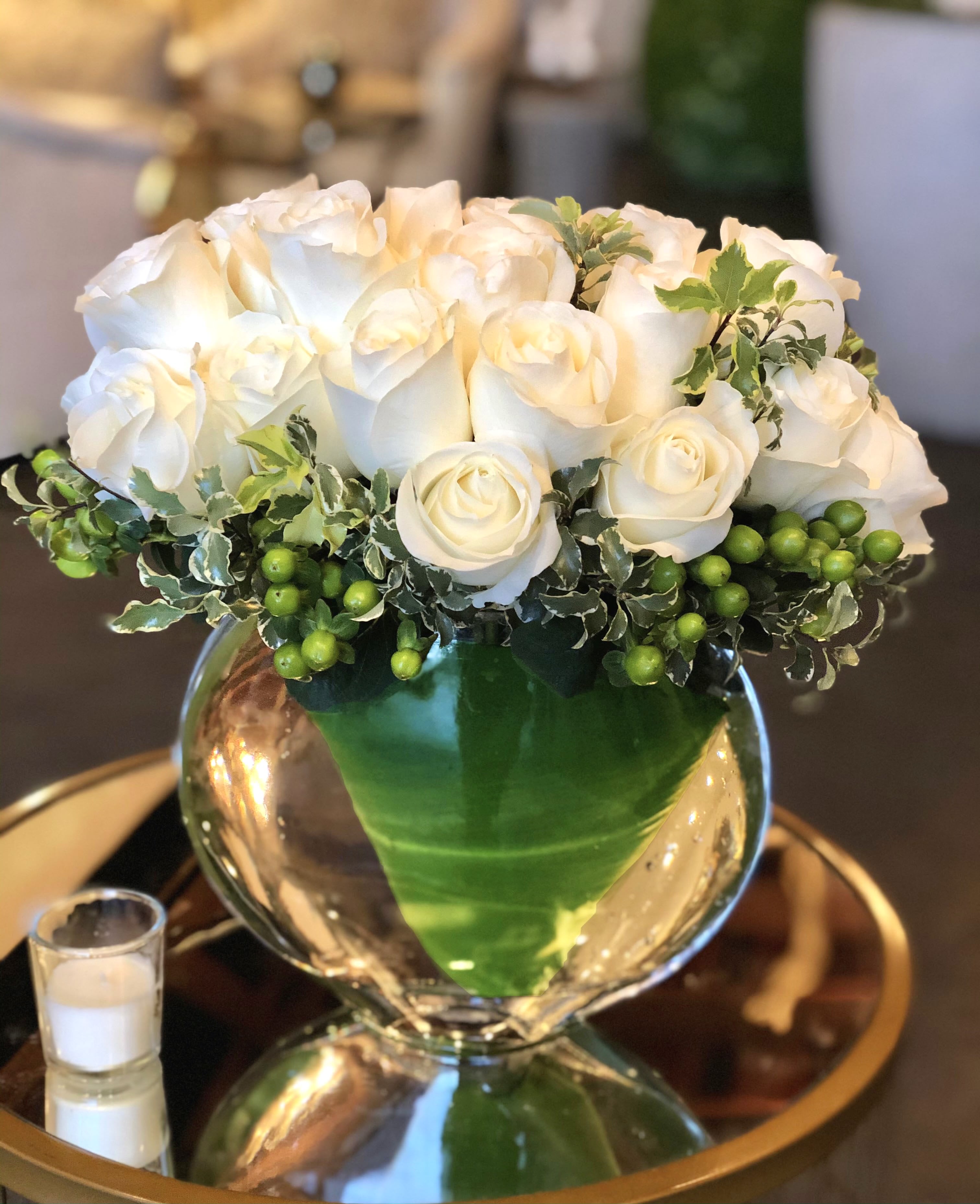 New Moon - This modern arrangement uses white roses to beautifully showcase a levitating arrangement!