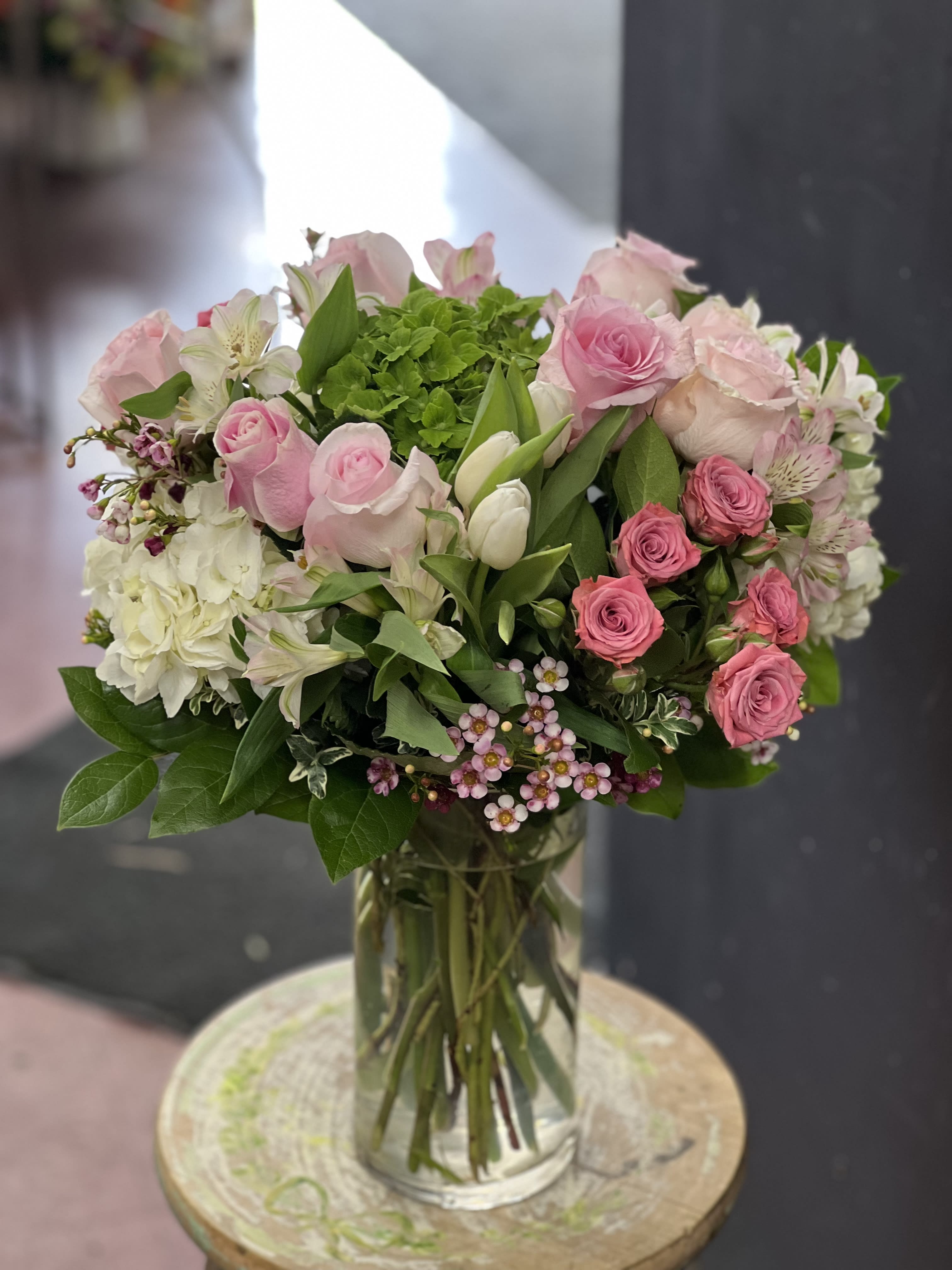 Princess Grace - Beautiful pink and white mixture. Flower arrangement in a cylindrical container. Perfect gift for birthday Mother’s Day. Get well. I love you.