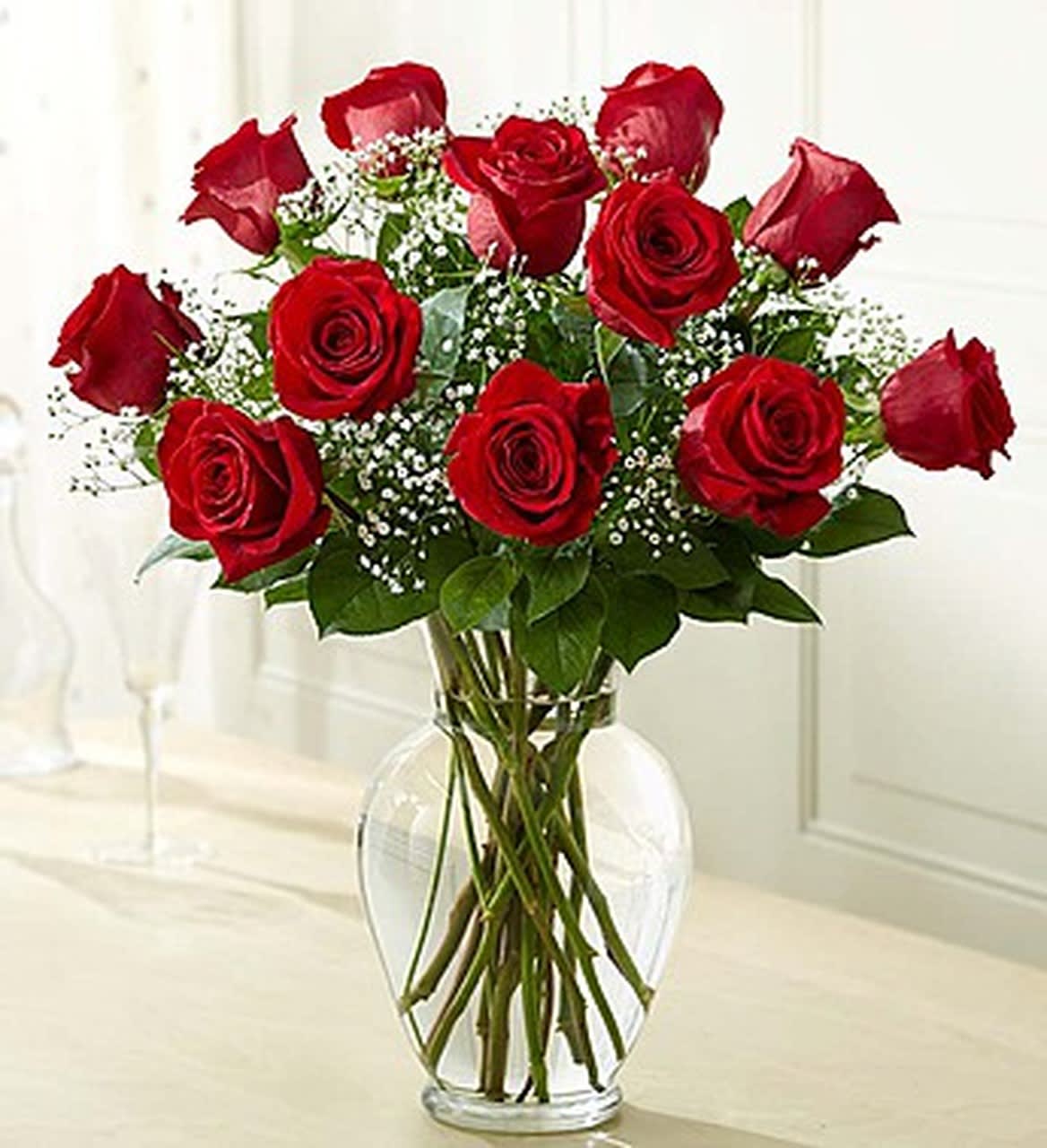 1 Dozen Beautiful Roses Vased - one Dozen Beautifully arranged roses with fillers and Greens. Comes in a clear vase.   NOTE: Specify in special instruction which color you would like Yellow, White, pink or Red or mix 