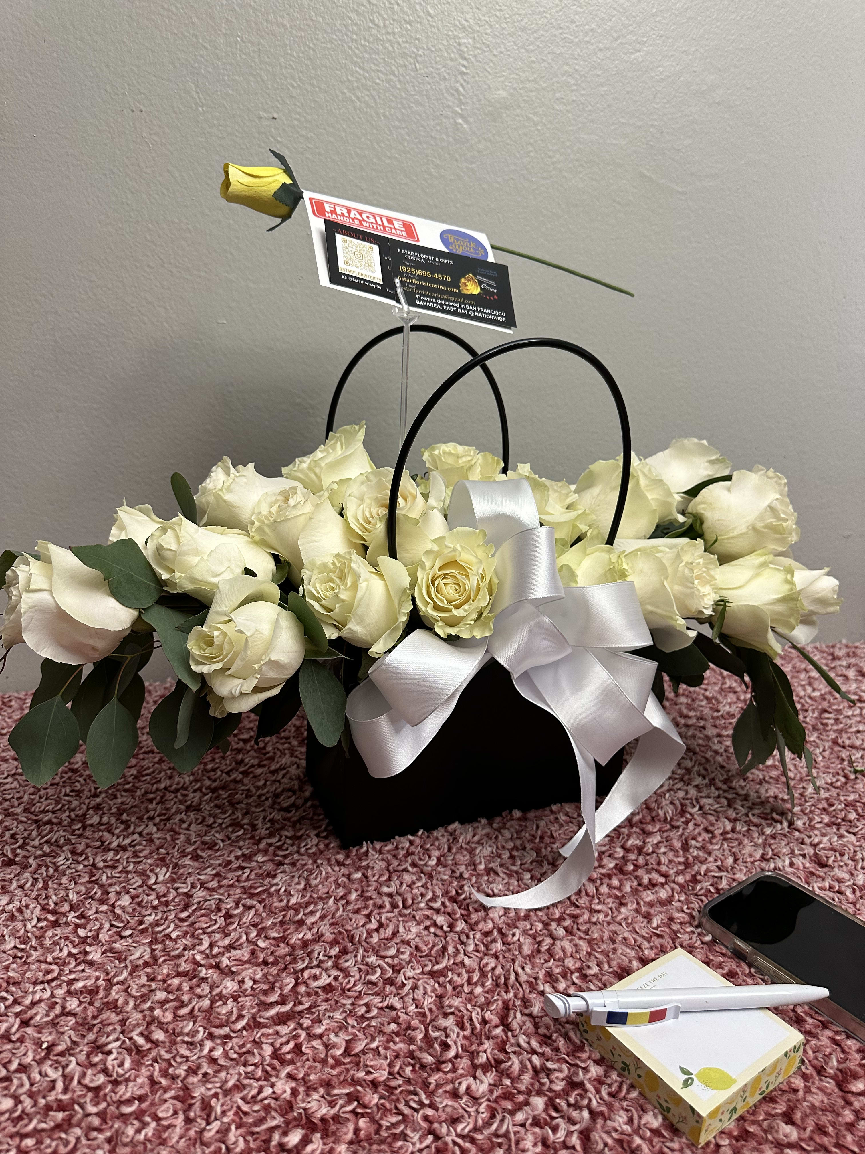 Black purse with flowers on sale