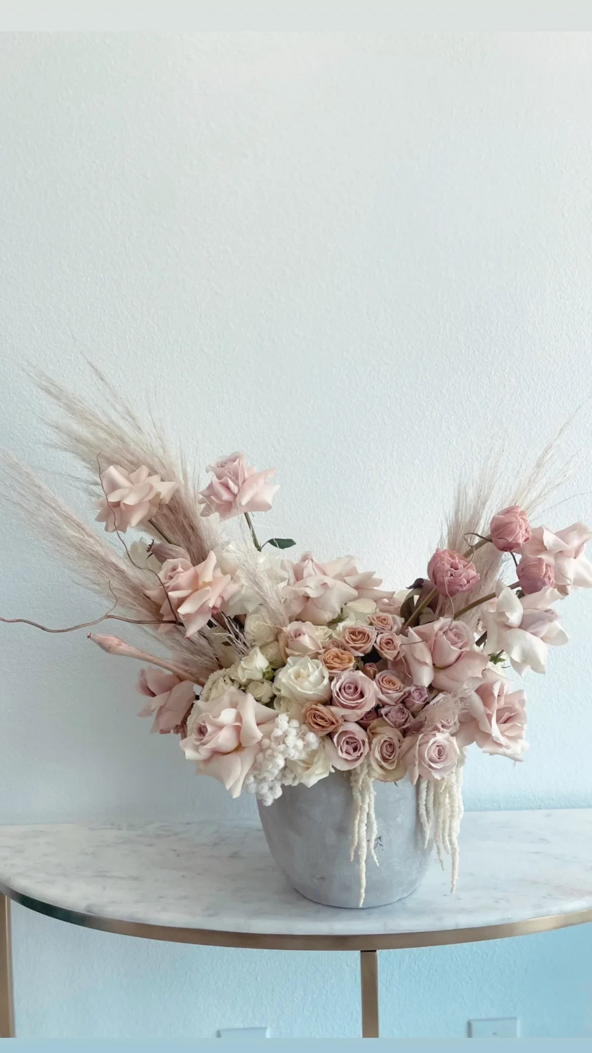 Milla  - We created this stunning arrangement filled with blush color roses, tulips, pampas grass, and Curley willows . Perfect gift for someone  special. It comes small , medium &amp; large. Contact us to order.  Each arrangement recreated this item description will not be identical to this image. The Flowers may be substituted for another type of flowers at the same value or grater. All Sales Are  Return Policy  All of our sales become final when order gets delivered and signed for. There will be no refund or exchange after delivery. 