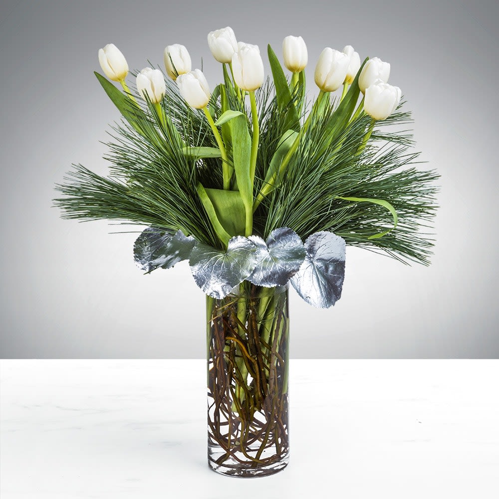 Tranquil Tulip By BloomNation™ - People spend lifetimes searching for inner peace. We’re not going to say the Tranquil Tulip arrangement will lead you immediately there. But, on the other hand, who wouldn’t want a bit of tulip comfort on their meandering path to lifelong serenity. Gift this arrangement to someone who deserves a bit of tranquility in their life this holiday season. 