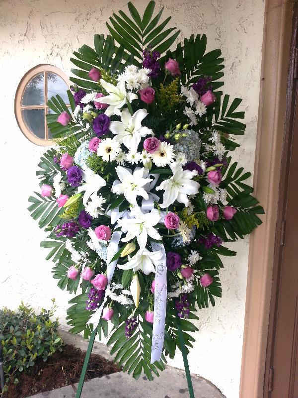 Extravagant Size Spray - this spray is about 7 feet tall. is has 2 dozen lavender roses, blue hydrangea, purple stock, white gerber daisies, purple lisianthus, yellow filler and whit poms. this can be made in many other colors 