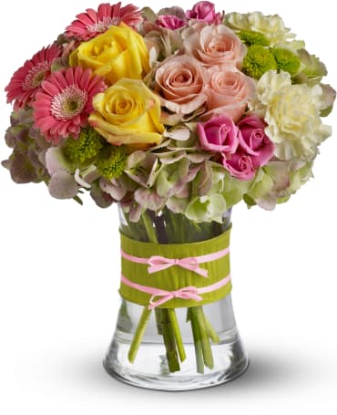 Fashionista Blooms -  Flowers are always in fashion! Especially this chic mix of pinks, greens and yellows, arranged in a style evoking the English hand-tied bouquet. It's a stylish surprise for any lucky lady.    Item # T155-1A 
