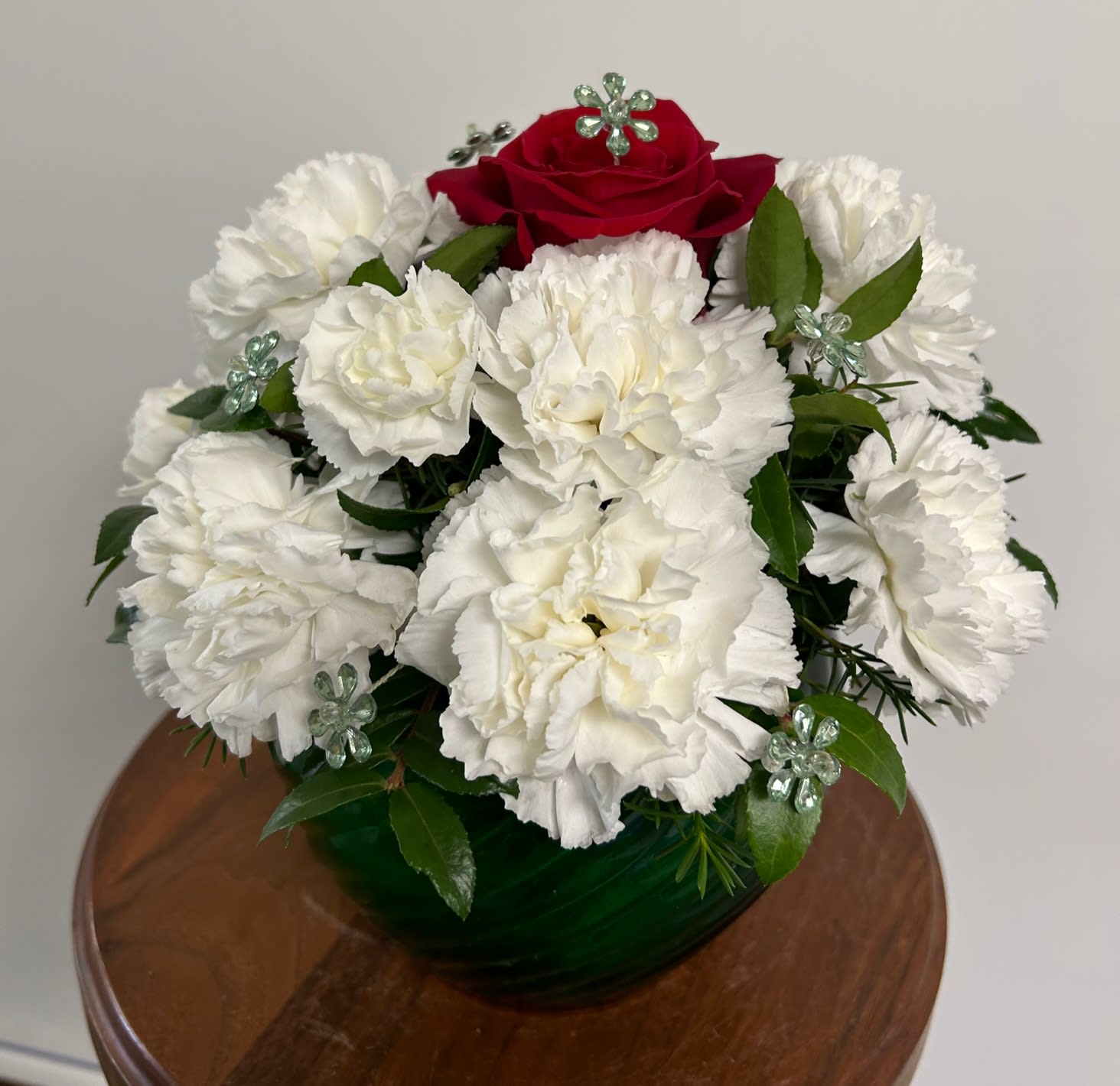 Dazzling Dream - A fun arrangement with a little sparkle!  A red rose surrounded by white carnations and daisy sparkle inserts.
