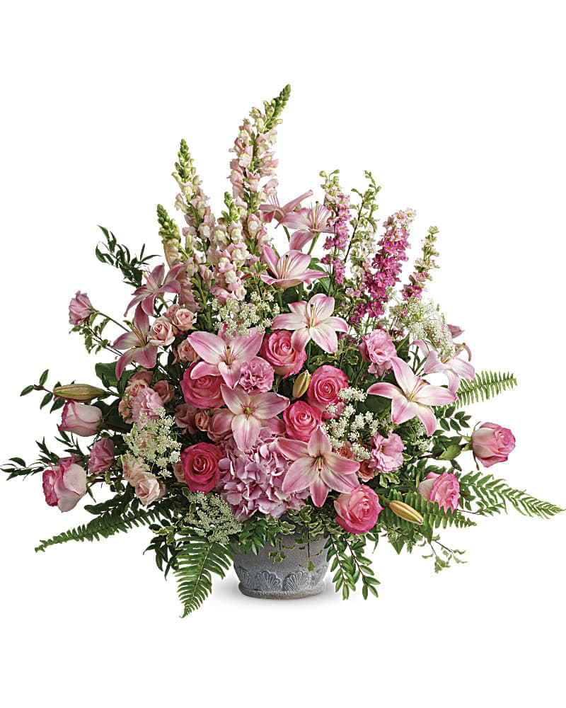 Teleflora's Graceful Glory Bouquet - An exuberant celebration of a beautiful life this glorious bouquet of pink hydrangea roses and lilies adds feminine grace to the service. Light pink hydrangea pink roses light pink spray roses light pink asiatic lilies pink lisianthus pink larkspur light pink snapdragons and Queen Anne's lace are arranged with Italian ruscus huckleberry pitta negra sword fern flat fern and lemon leaf. Delivered in a Parisian Garden Pot.