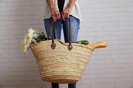 Moroccan Shopping Basket - Our basket is made with an authentic Moroccan leather strap. The leather straps fit comfortably over the shoulder. All of the baskets are easily stackable for easy storage in between shopping trips. These roomy baskets are easy to clean, and their simplicity is elegant and stylish. Made in Morocco