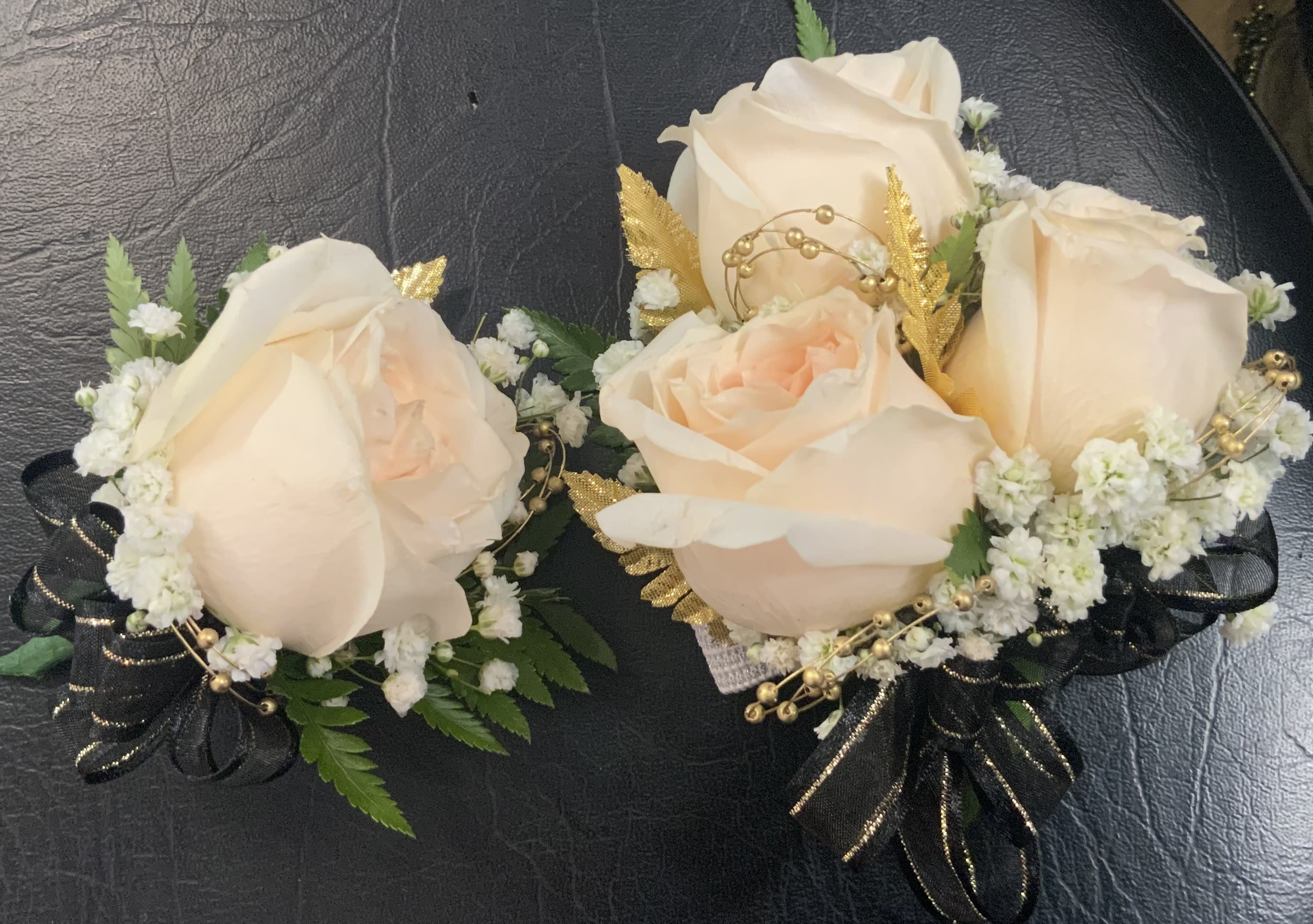 Corsage Set - It's Prom Season the perfect time to get Your Corsage. A Different Color Rose is available upon request. A Different Color Bow is available upon request. Beads available only in Gold, Silver or Pearl. Leaves Available in Silver or Gold.