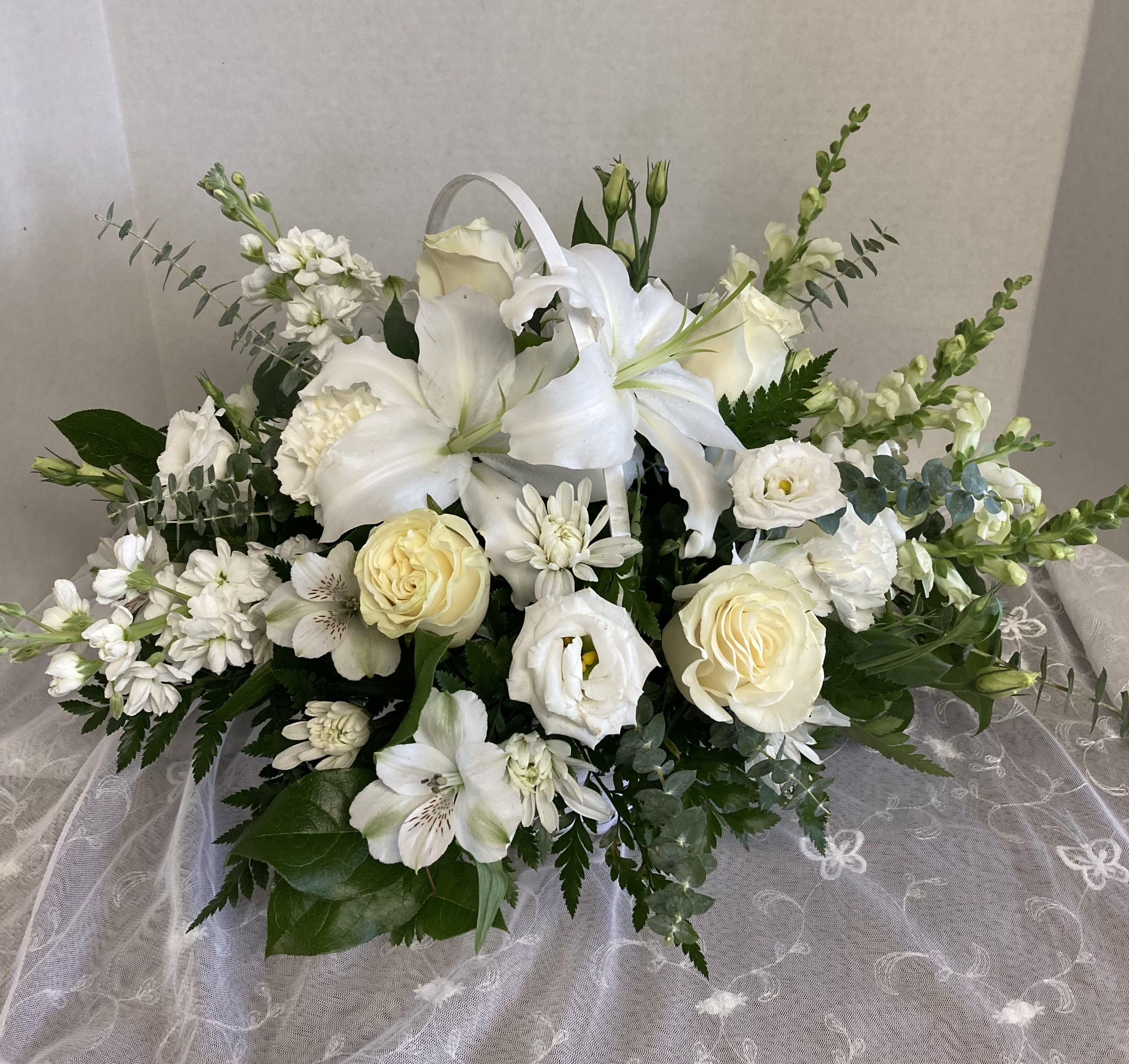 Journey of Love - Elegant whites, expression of sympathy as well as a lovely gift for many occassions.   Suitable for funeral service and home delivery.  Featuring roses, stock, lily, alstromeria and more