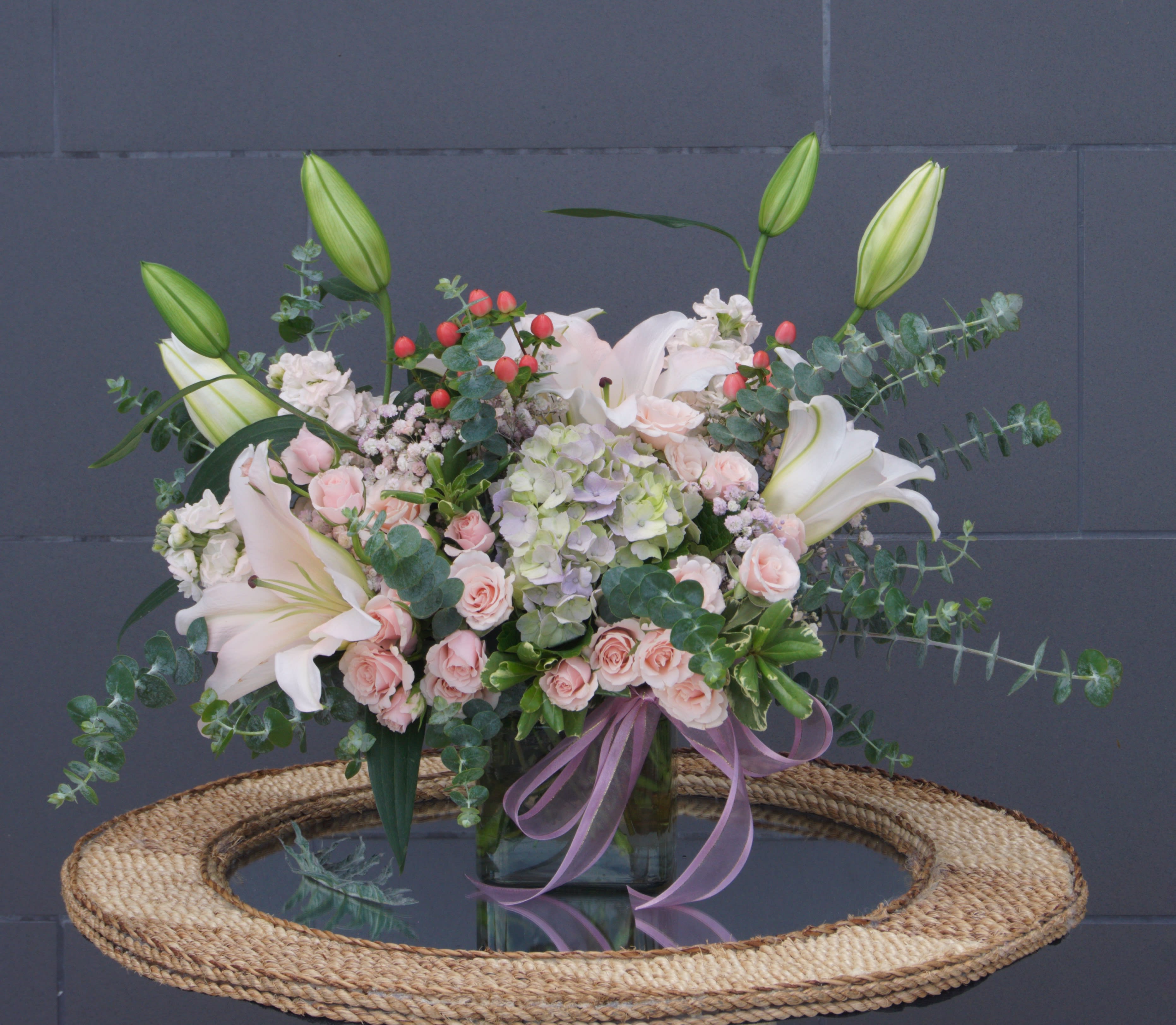 Sakura - Sweet pink blooms including lily, rose, fragrant stock, hydrangea and nice accents.