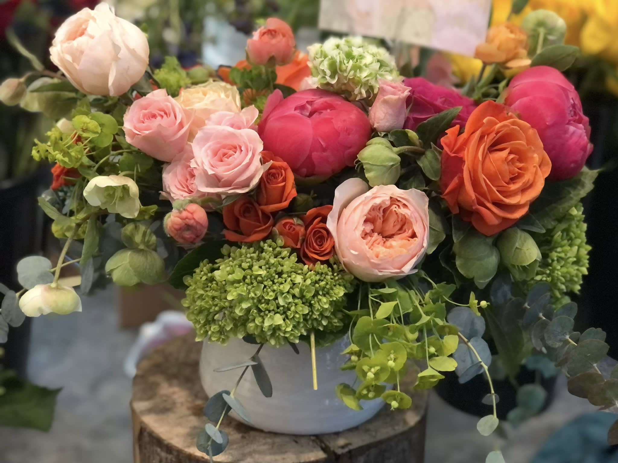 Coral Crush Designer's Choice - A real show-stopper! This beauty includes premium specialty blooms and roses. Sure to impress any flower connoisseur. 